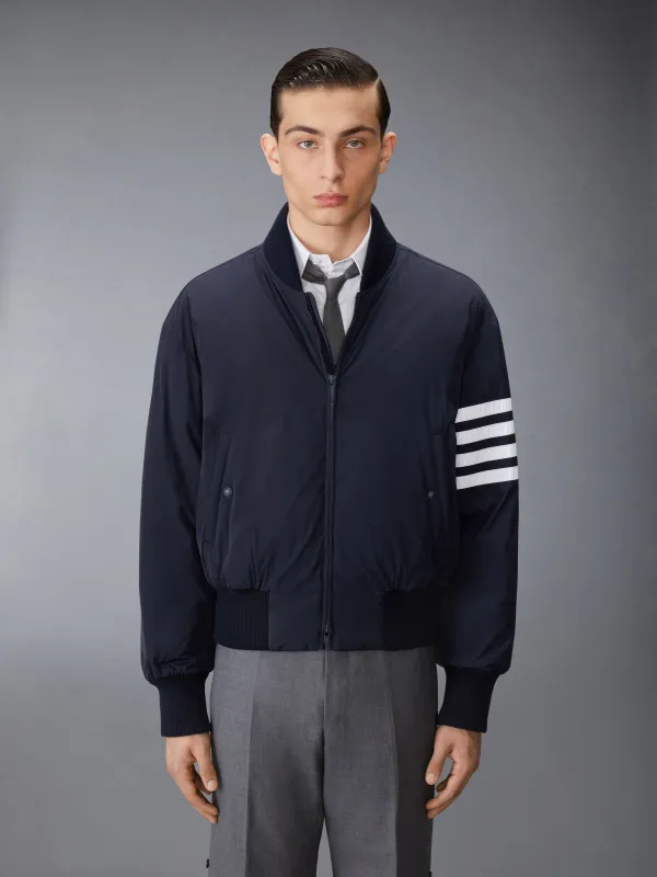 POLY TWILL 4-BAR OVERSIZED KNIT DOWN BLOUSON JACKET sold by Thom Browne