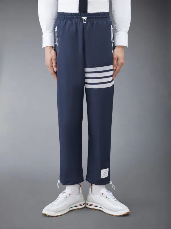 RIPSTOP MESH 4-BAR SWEATPANTS sold by Thom Browne