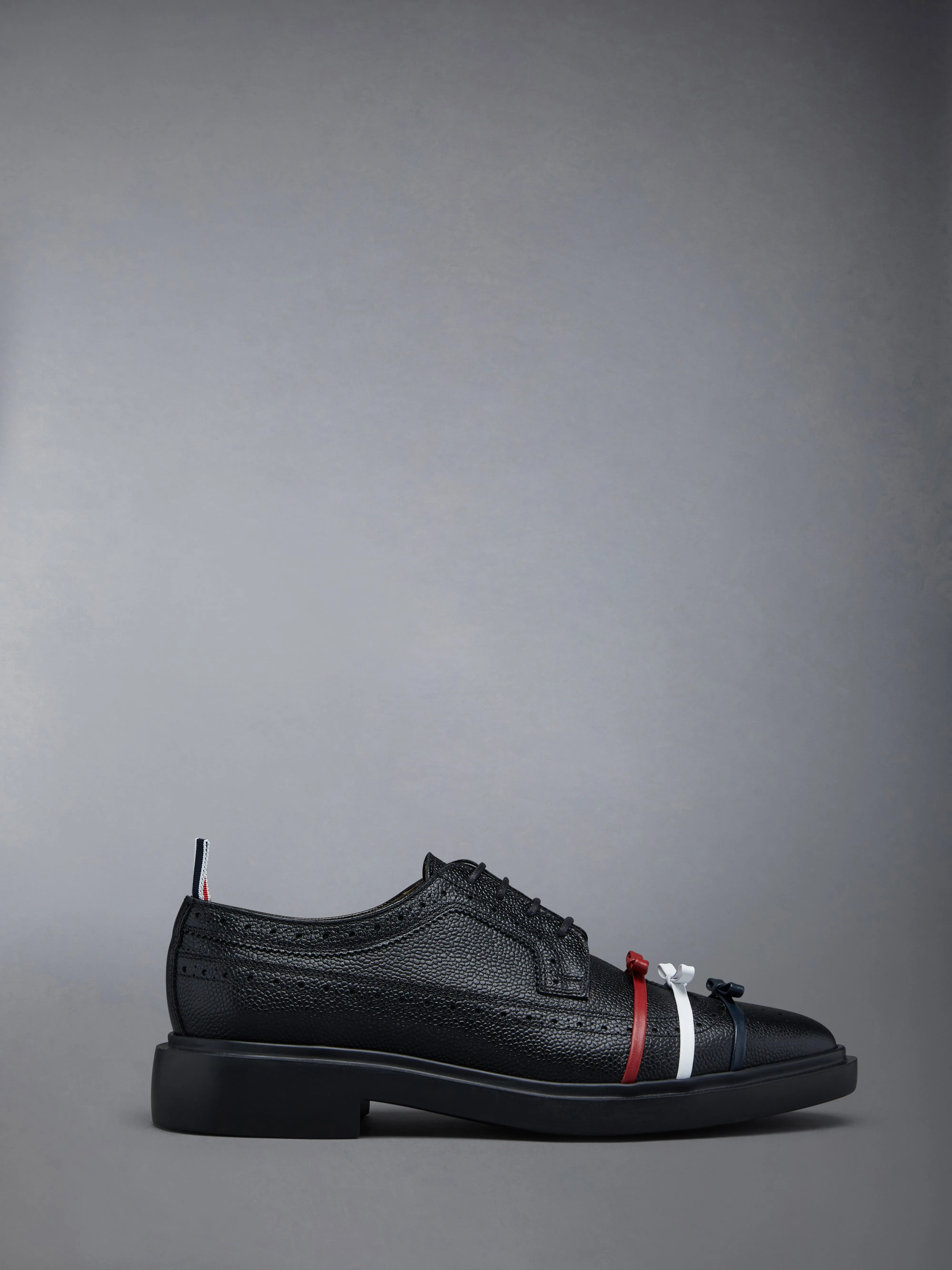 RUBBER SOLE 3-BOW LONGWING BROGUE sold by Thom Browne