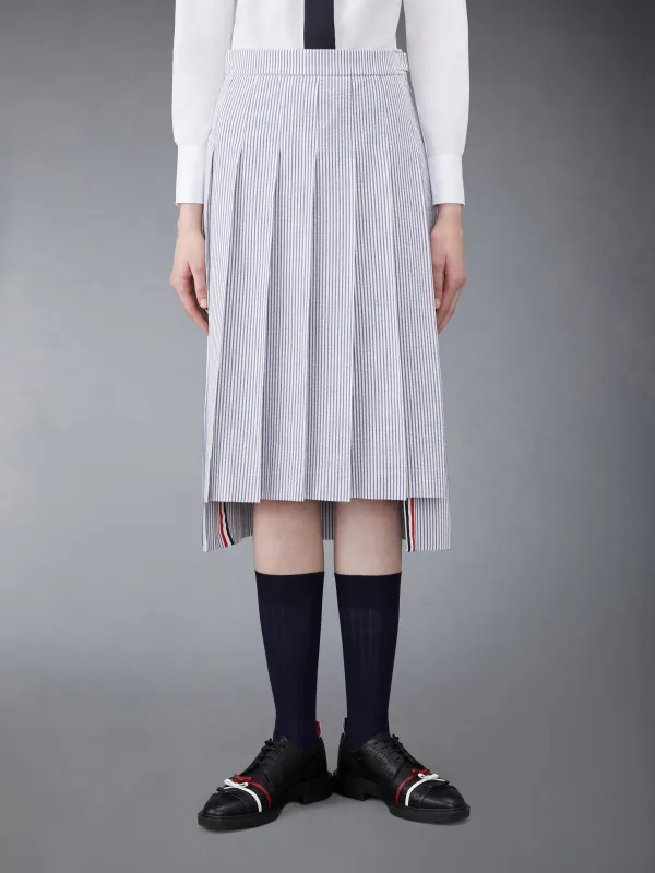 SEERSUCKER MIDI PLEATED SKIRT sold by Thom Browne