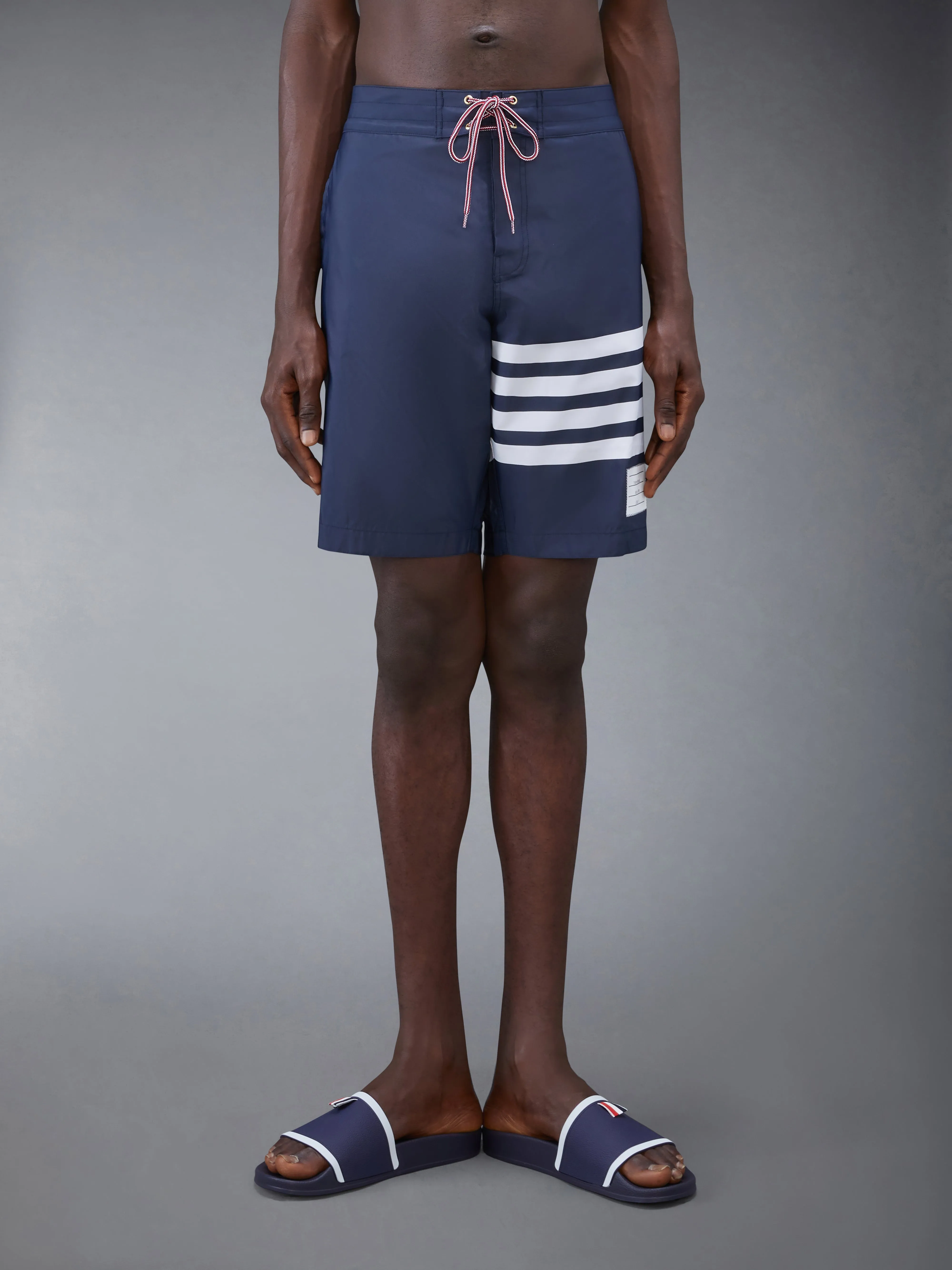SWIM TECH 4-BAR BOARD SHORTS sold by Thom Browne