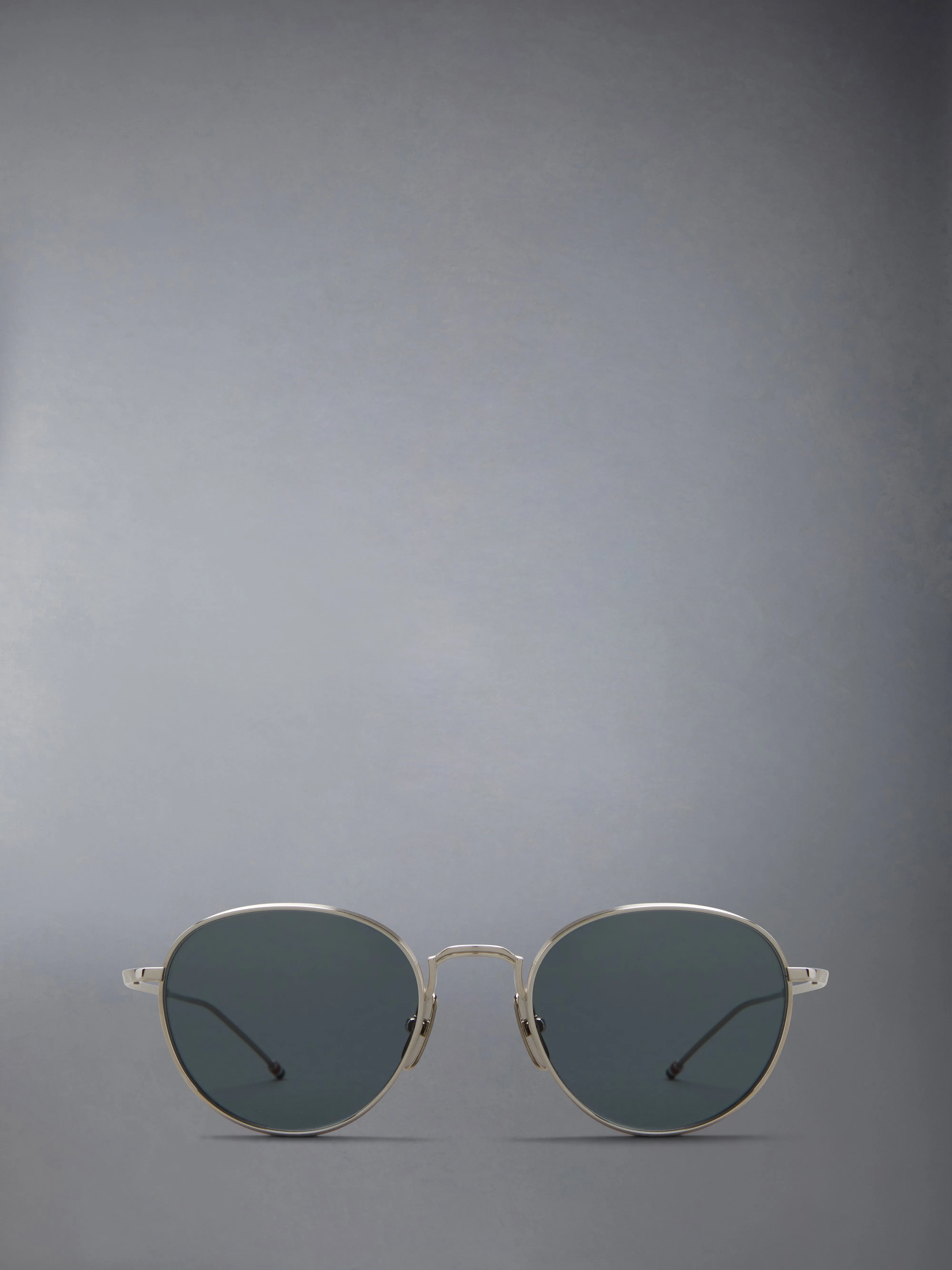 TITANIUM ROUND SUNGLASSES sold by Thom Browne