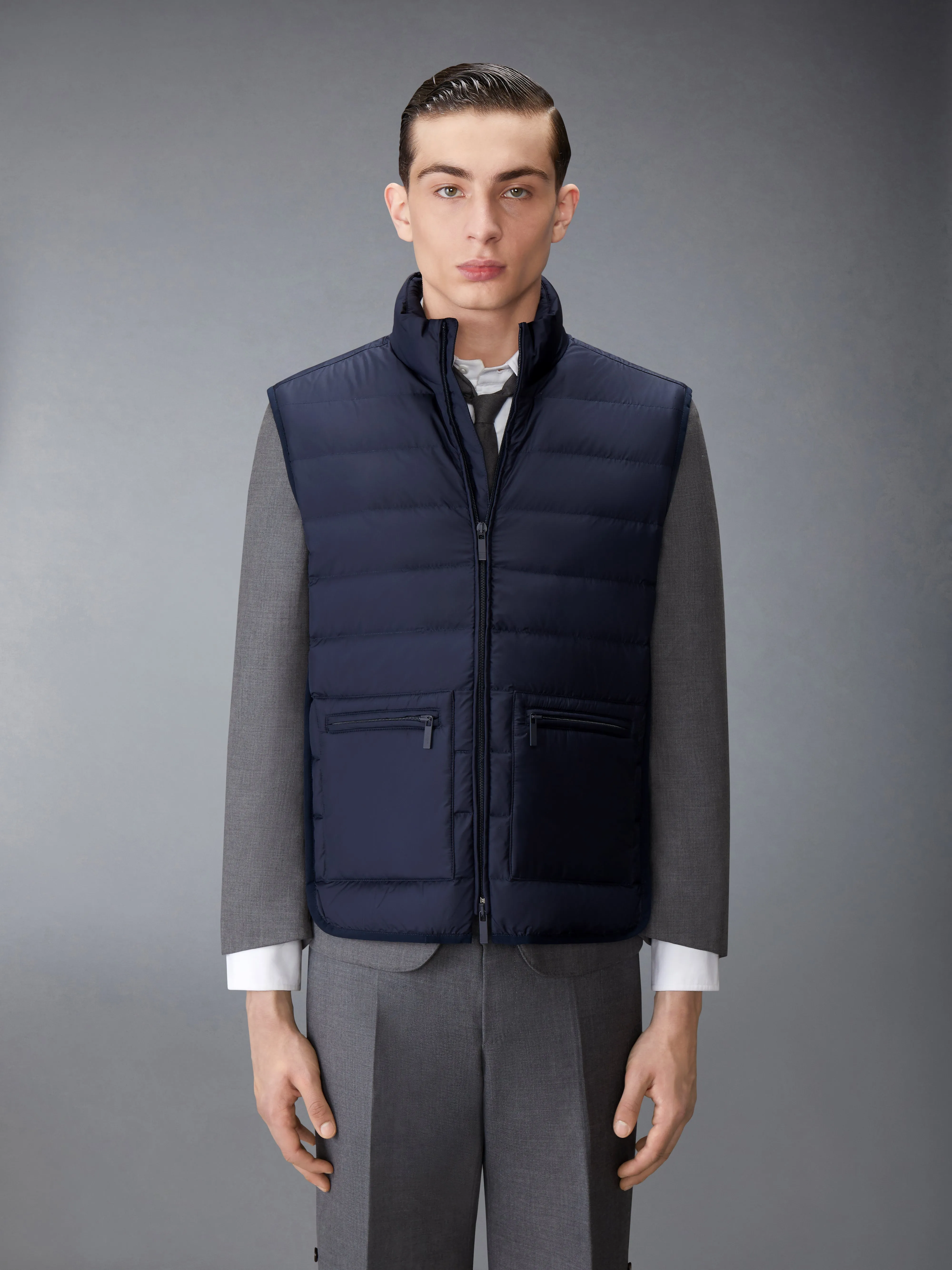 ULTRA LIGHT NYLON TECH FUNNEL NECK DOWN VEST sold by Thom Browne