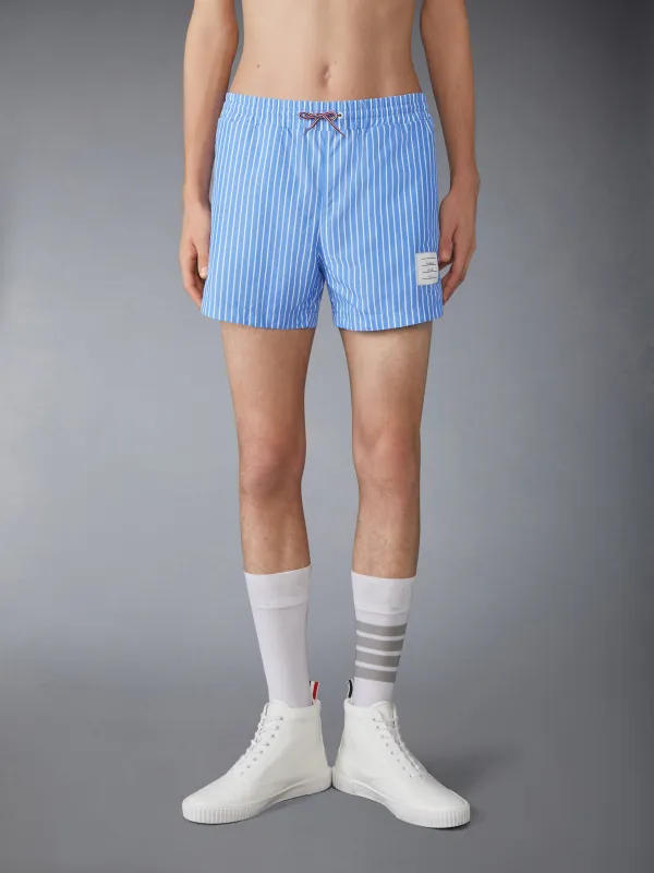 PINSTRIPE PRINTED TECH SWIM SHORTS sold by Thom Browne