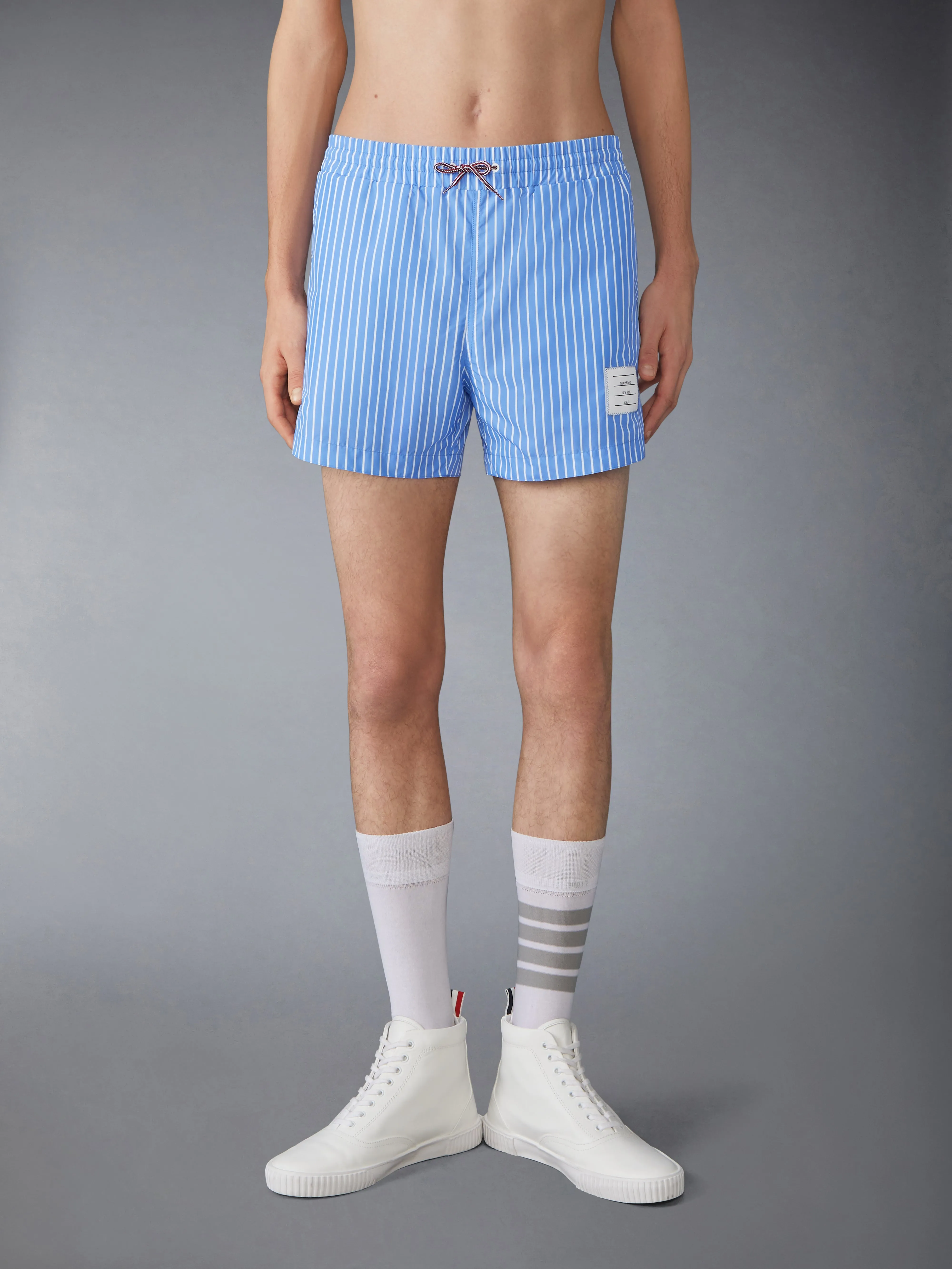 PINSTRIPE PRINTED TECH SWIM SHORTS sold by Thom Browne