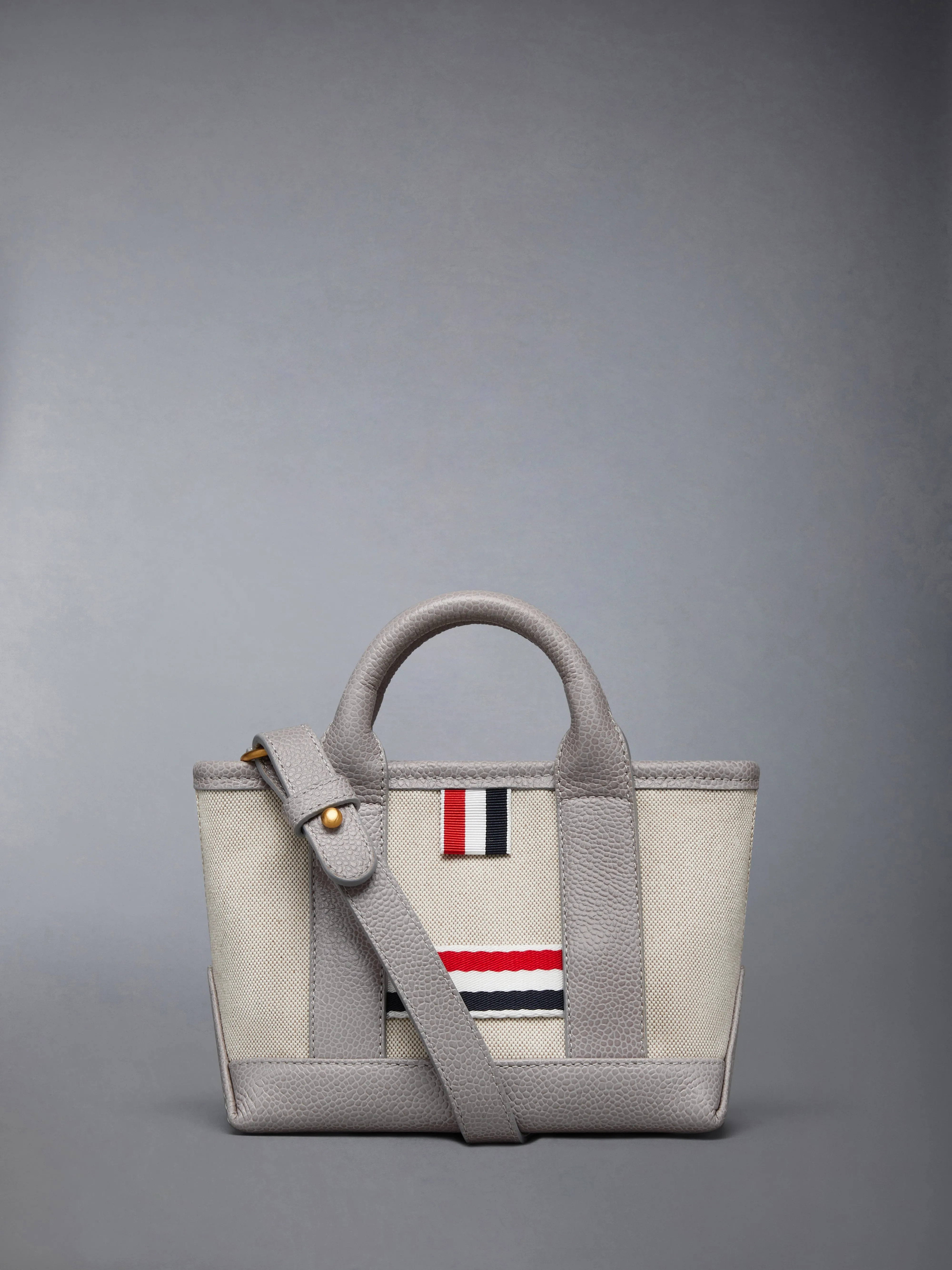 SALT AND PEPPER COTTON CANVAS MICRO TOOL TOTE sold by Thom Browne