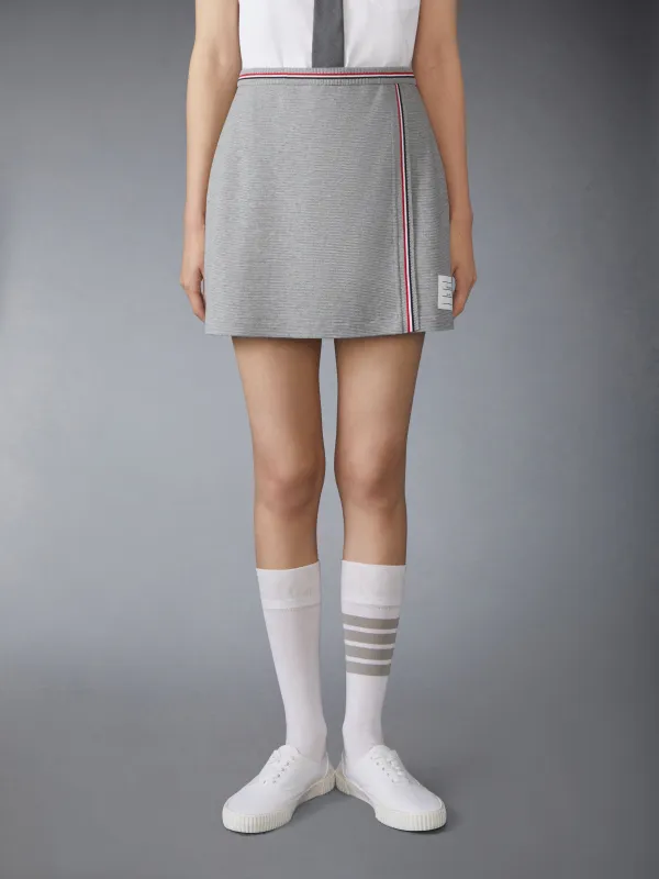 COTTON WAFFLE MINI WRAP SKIRT sold by Thom Browne