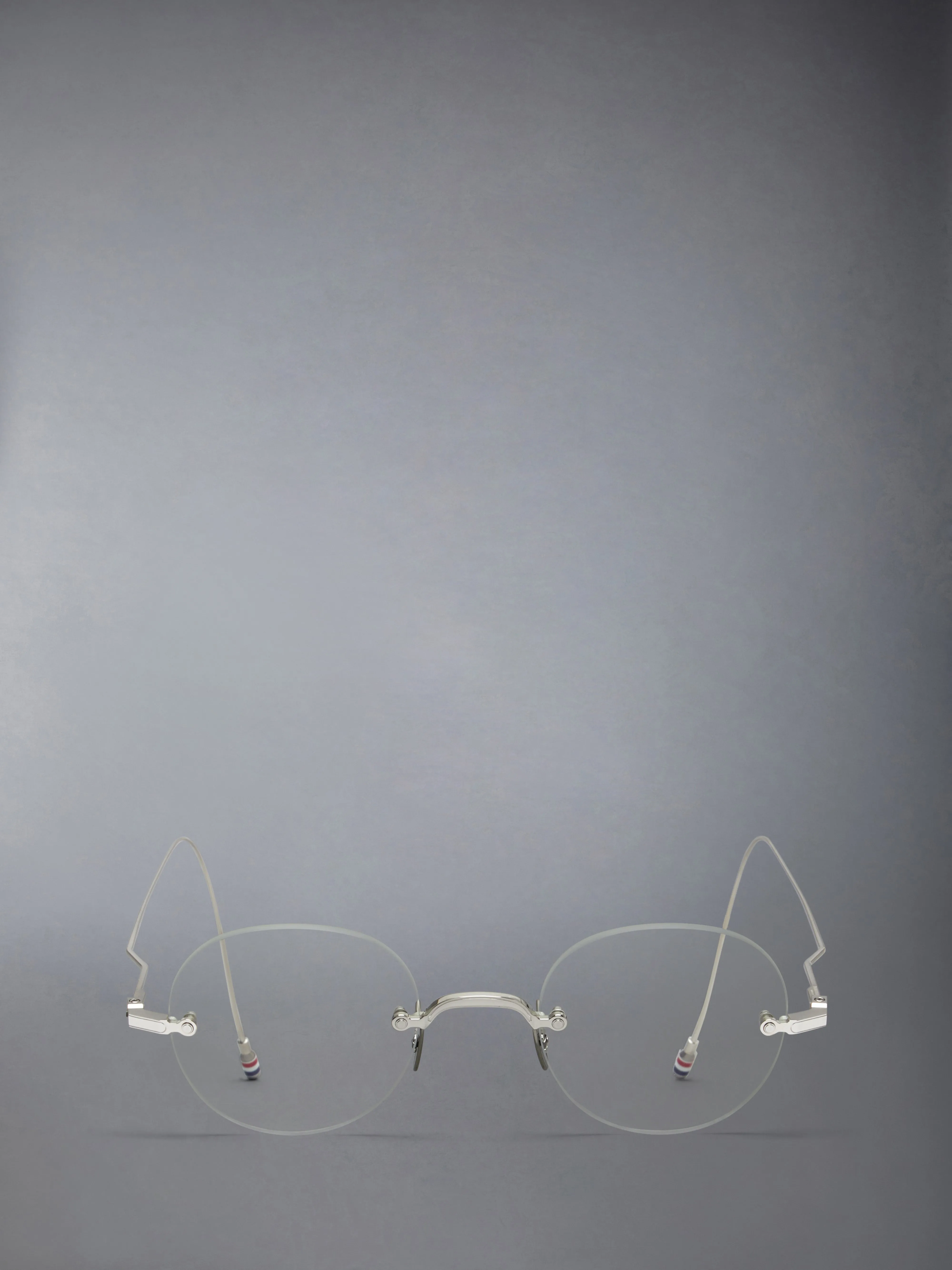 TITANIUM RIMLESS ROUND EYEGLASSES sold by Thom Browne