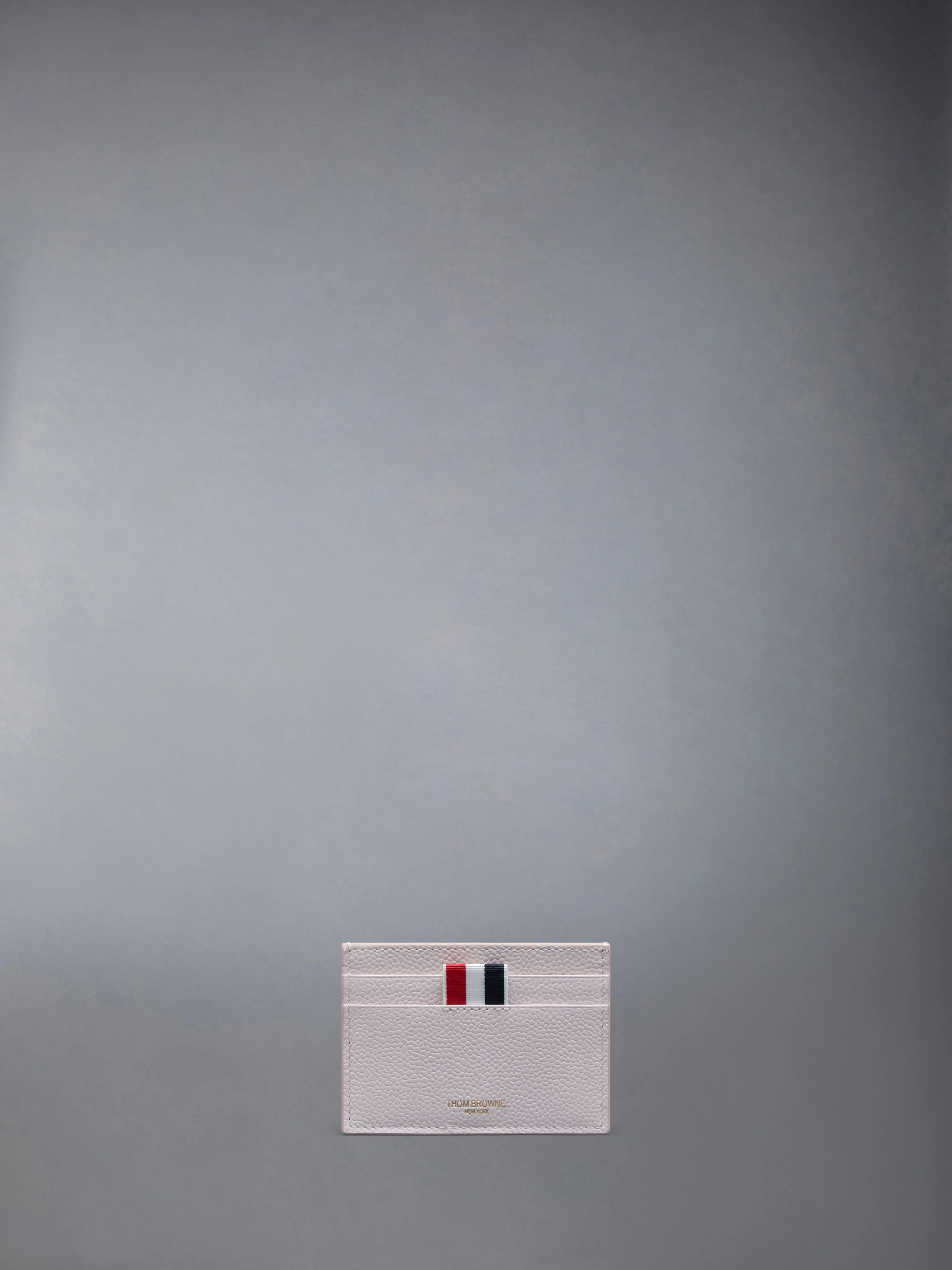PEBBLE GRAIN DOUBLE SIDED CARD HOLDER sold by Thom Browne
