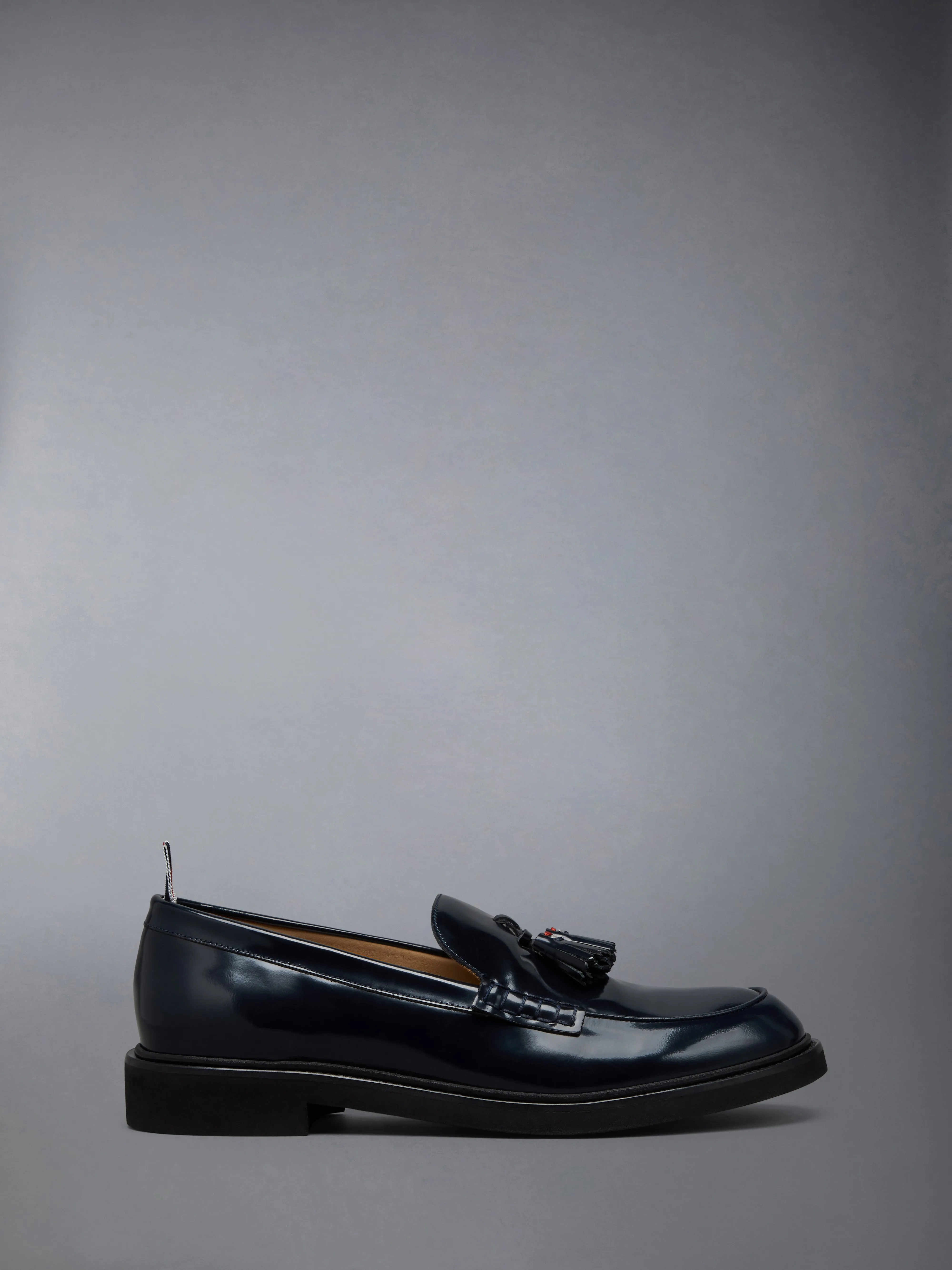 SPAZZOLATO LEATHER TASSLE LOAFER sold by Thom Browne