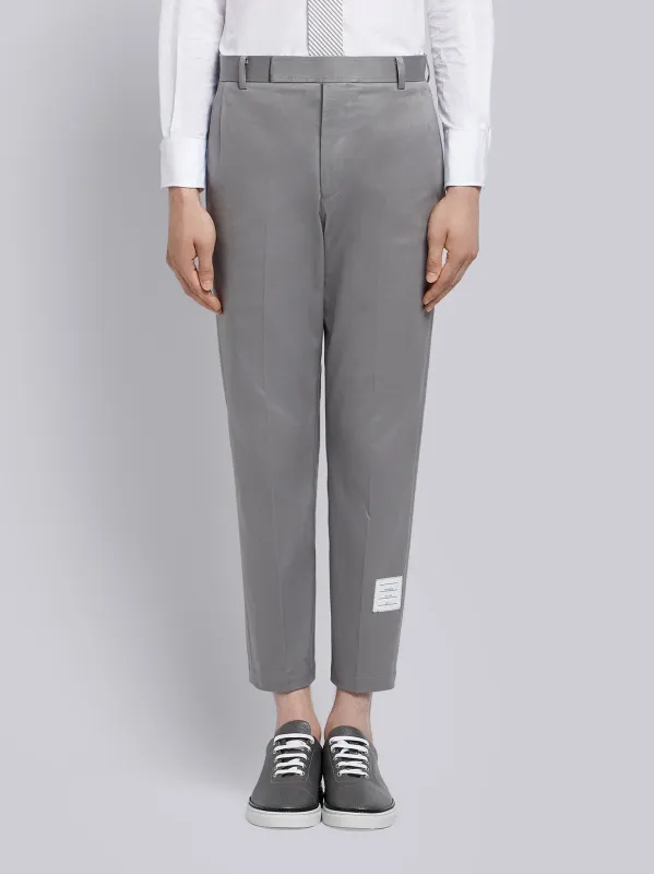 UNCONSTRUCTED COTTON TWILL CHINO TROUSERS sold by Thom Browne