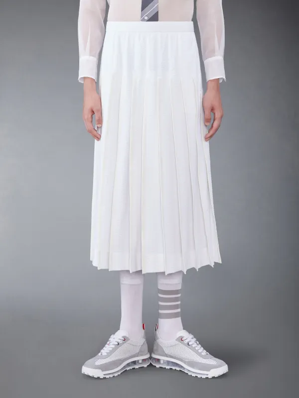COTTON SEERSUCKER PLEATED SKIRT sold by Thom Browne