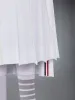 COTTON SEERSUCKER PLEATED SKIRT sold by Thom Browne