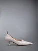 SOFT PATENT LEATHER WINGTIP 50MM CURVED HEEL PUMP sold by Thom Browne