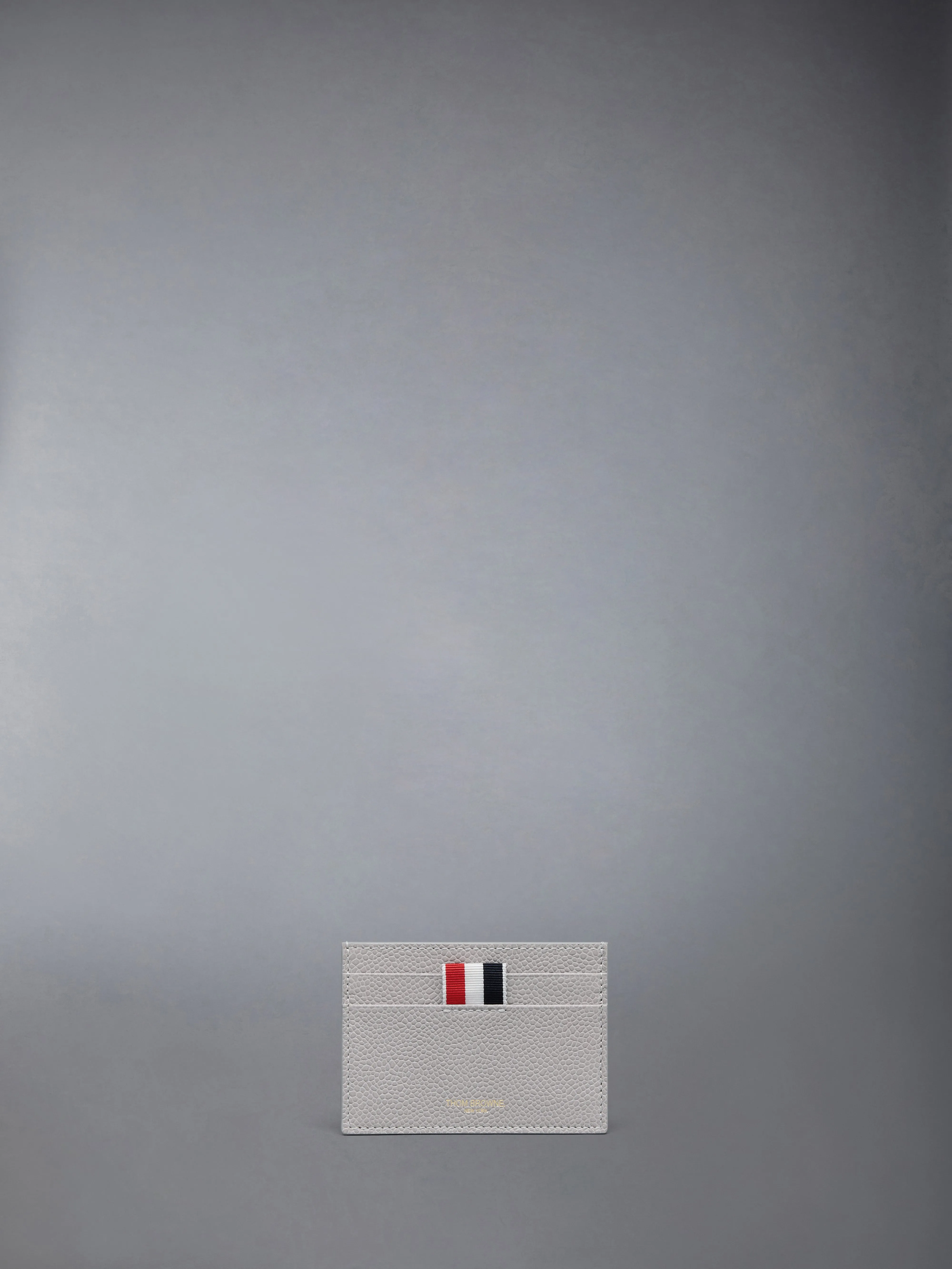 PEBBLE GRAIN 4-BAR SINGLE CARD HOLDER sold by Thom Browne