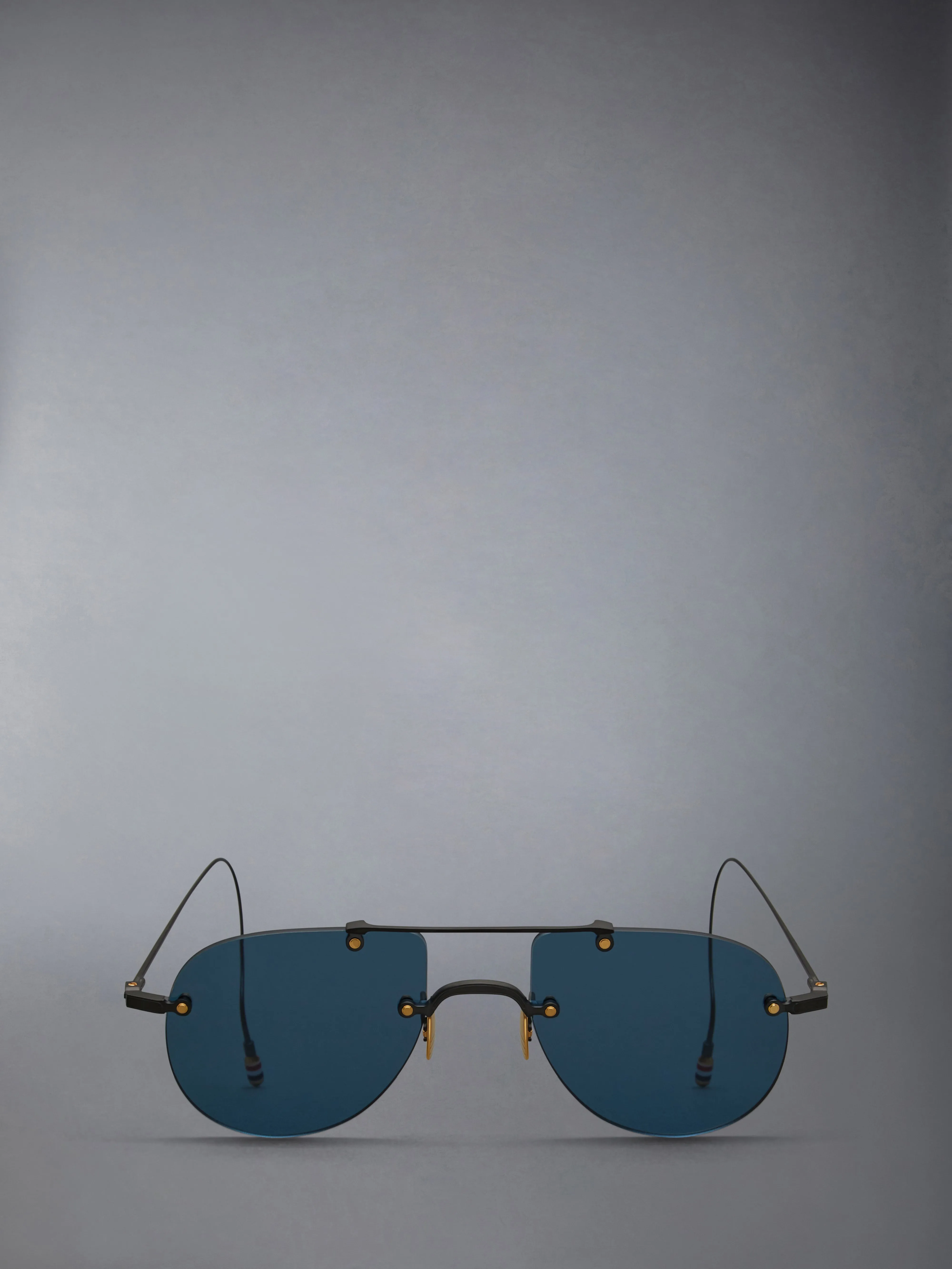 TITANIUM RIMLESS AVIATOR SUNGLASSES sold by Thom Browne