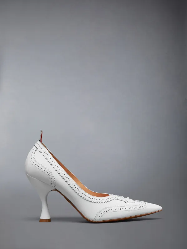 SOFT PATENT LEATHER WINGTIP 90MM CURVED HEEL PUMP sold by Thom Browne
