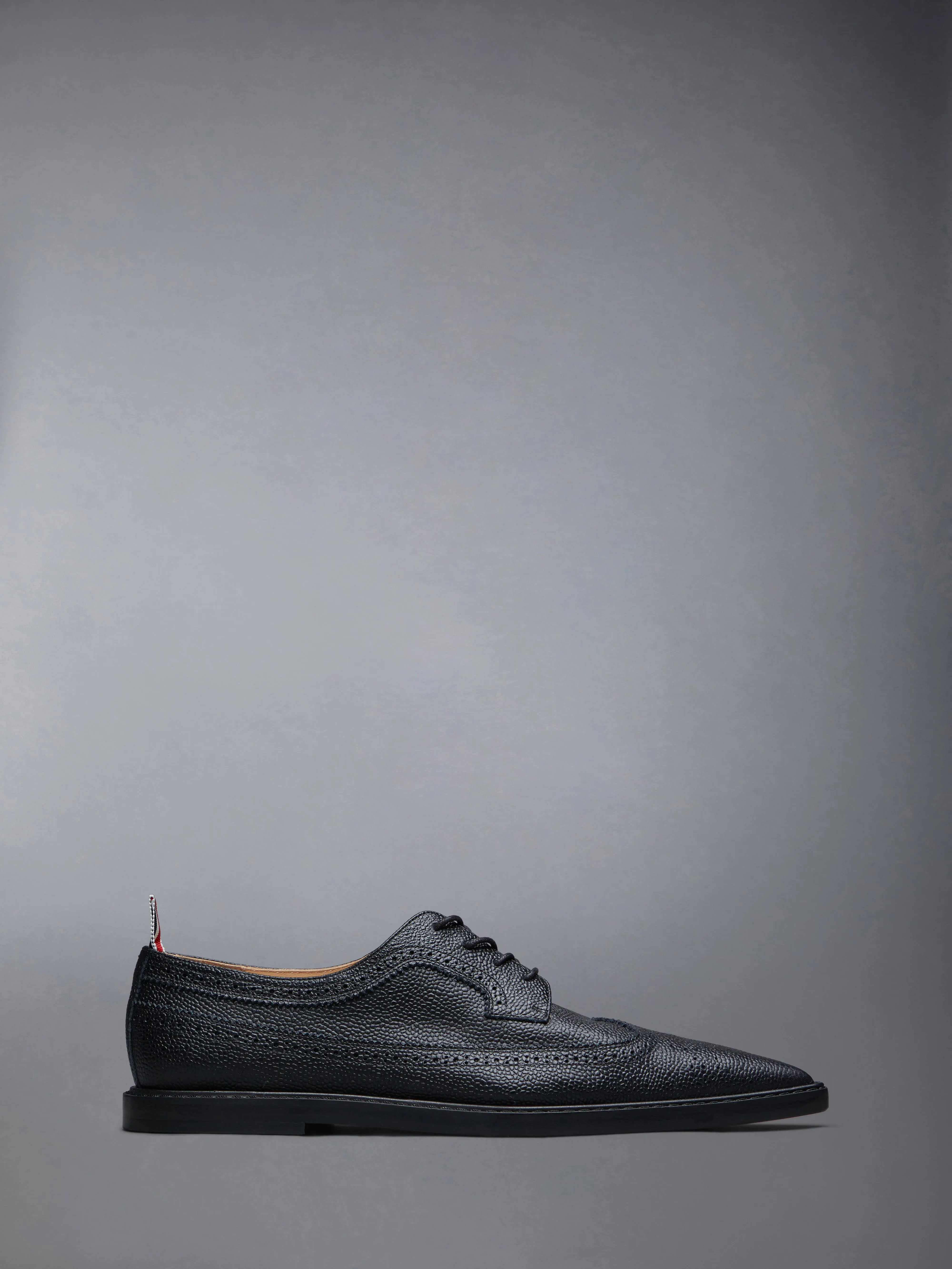 PEBBLE GRAIN LONGWING POINTED BROGUE sold by Thom Browne