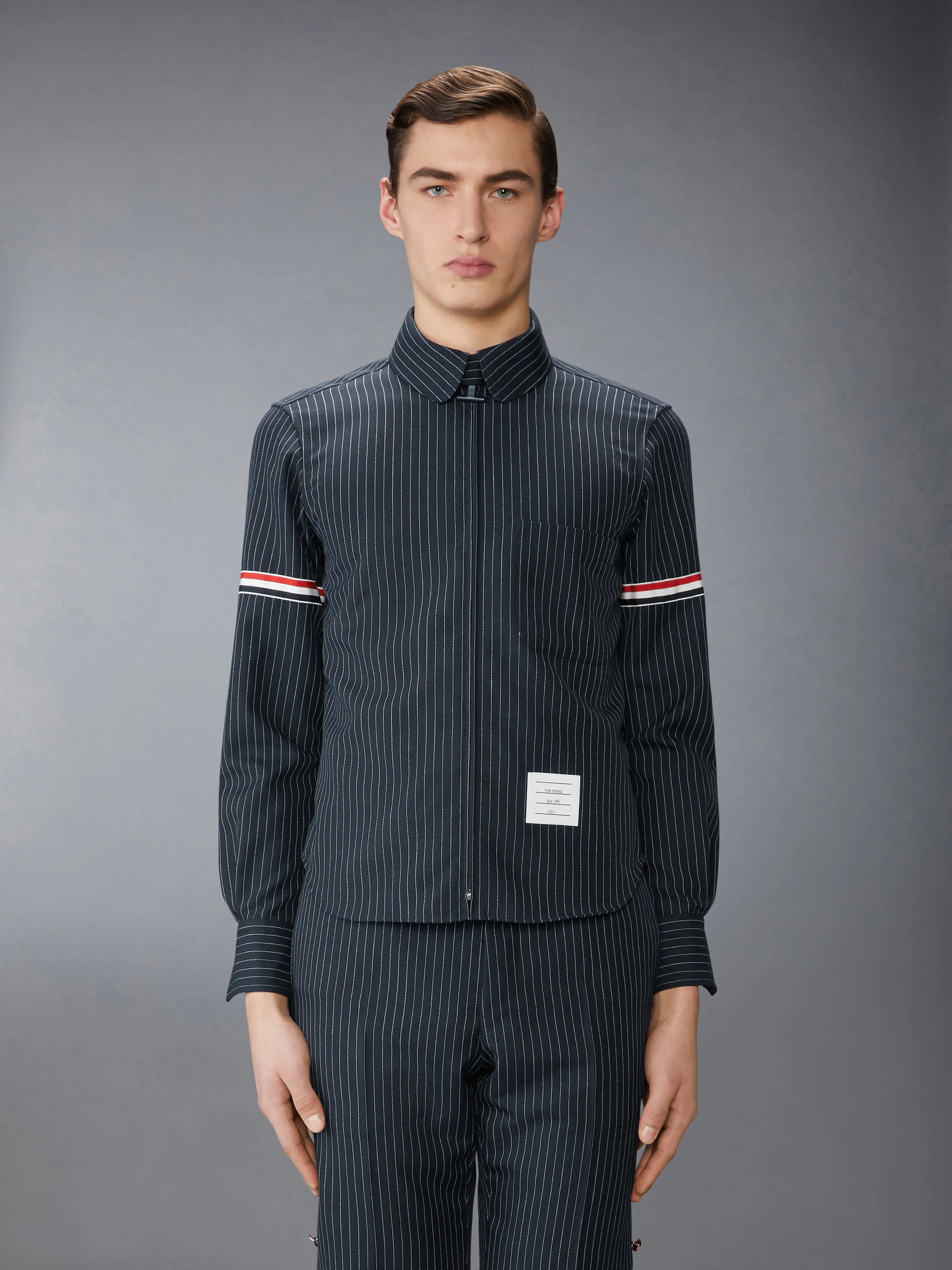 PINSTRIPE HIGH TWIST WOOL ZIP UP SHIRT sold by Thom Browne