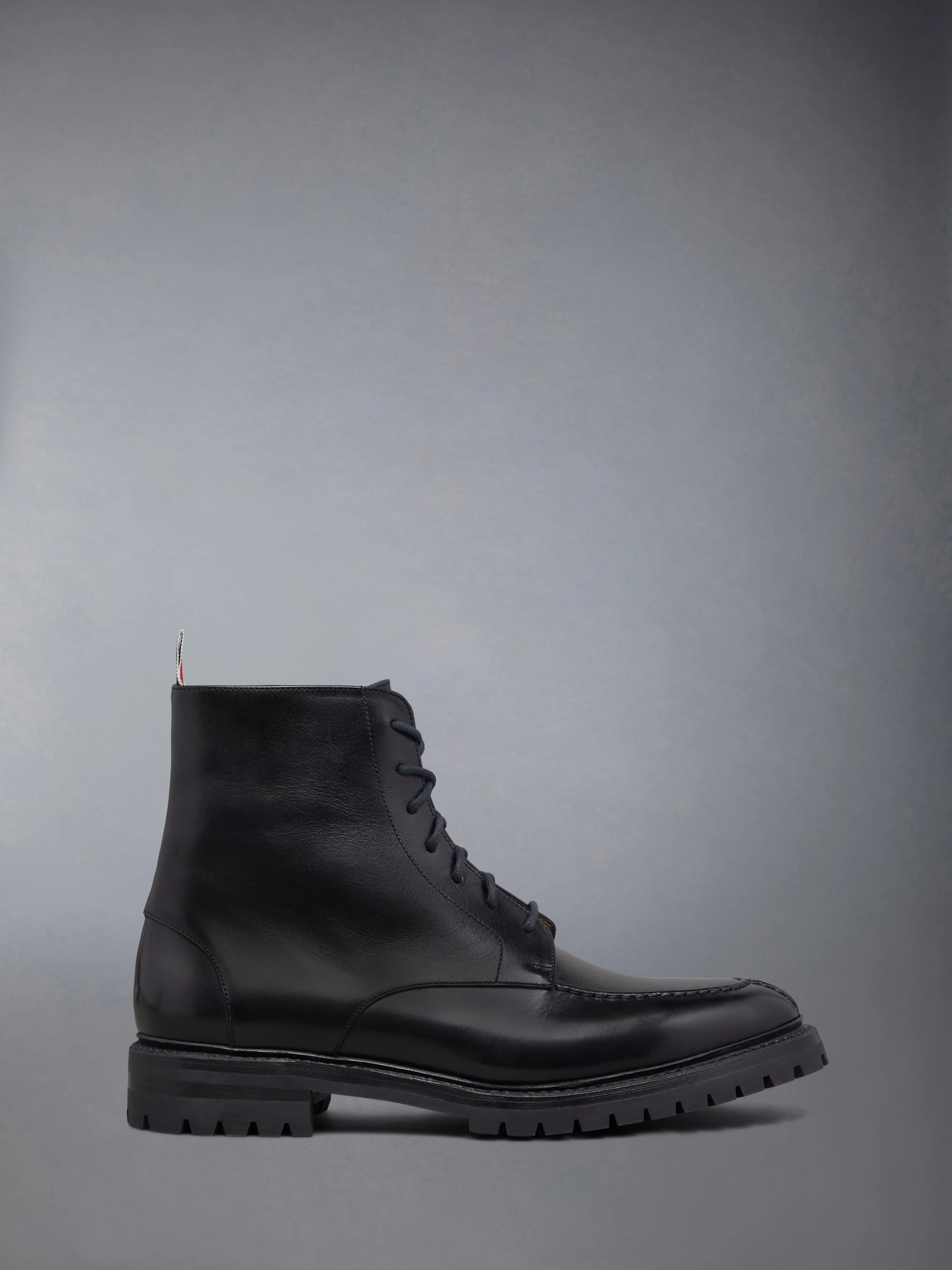 BOX CALF COMMANDO SOLE APRON STITCH BOOT sold by Thom Browne