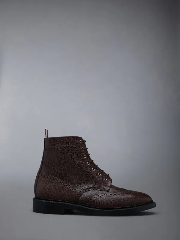 BOX CALF RUBBER SOLE WINGTIP BOOT sold by Thom Browne