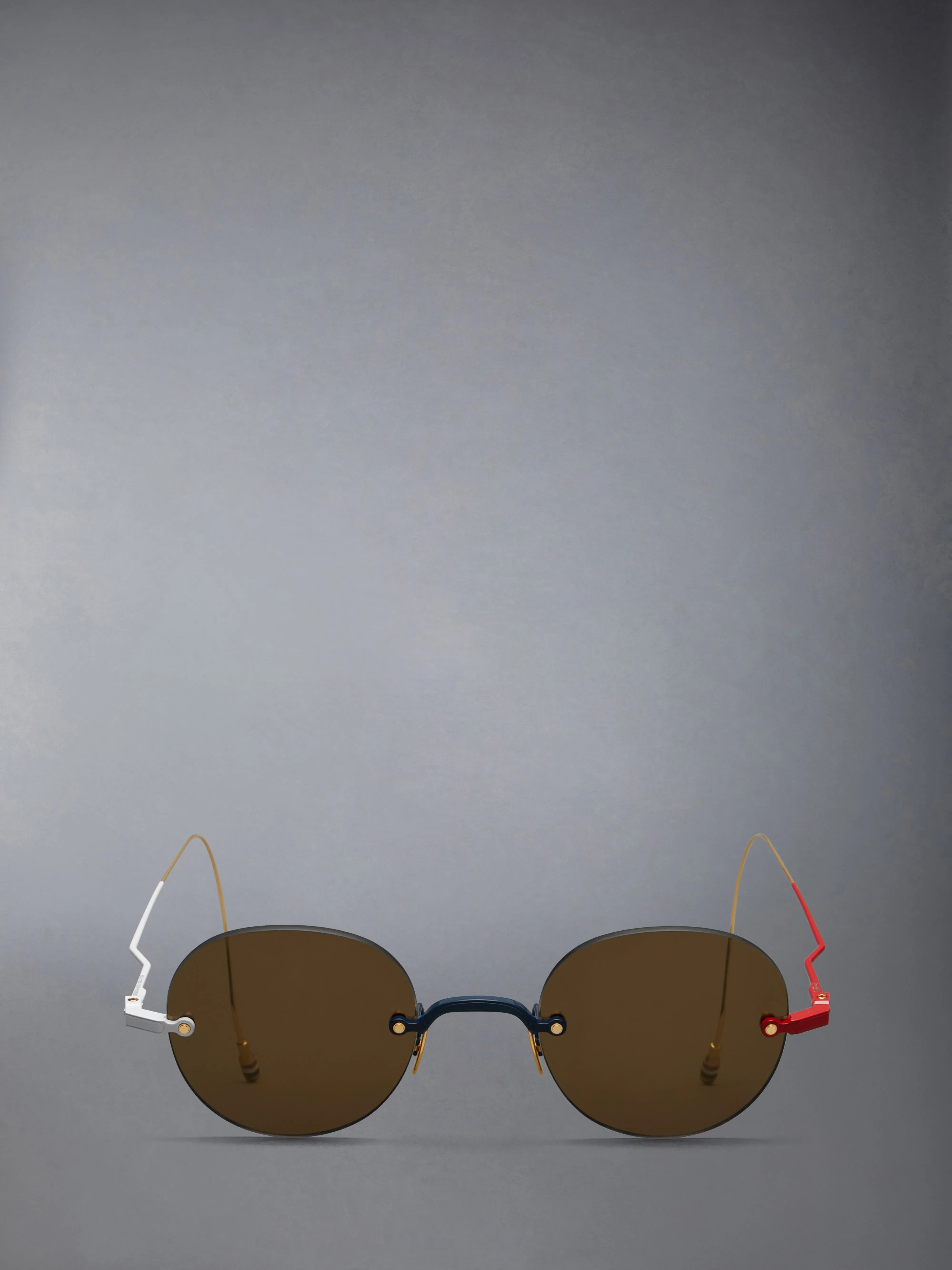 TITANIUM RIMLESS ROUND SUNGLASSES sold by Thom Browne
