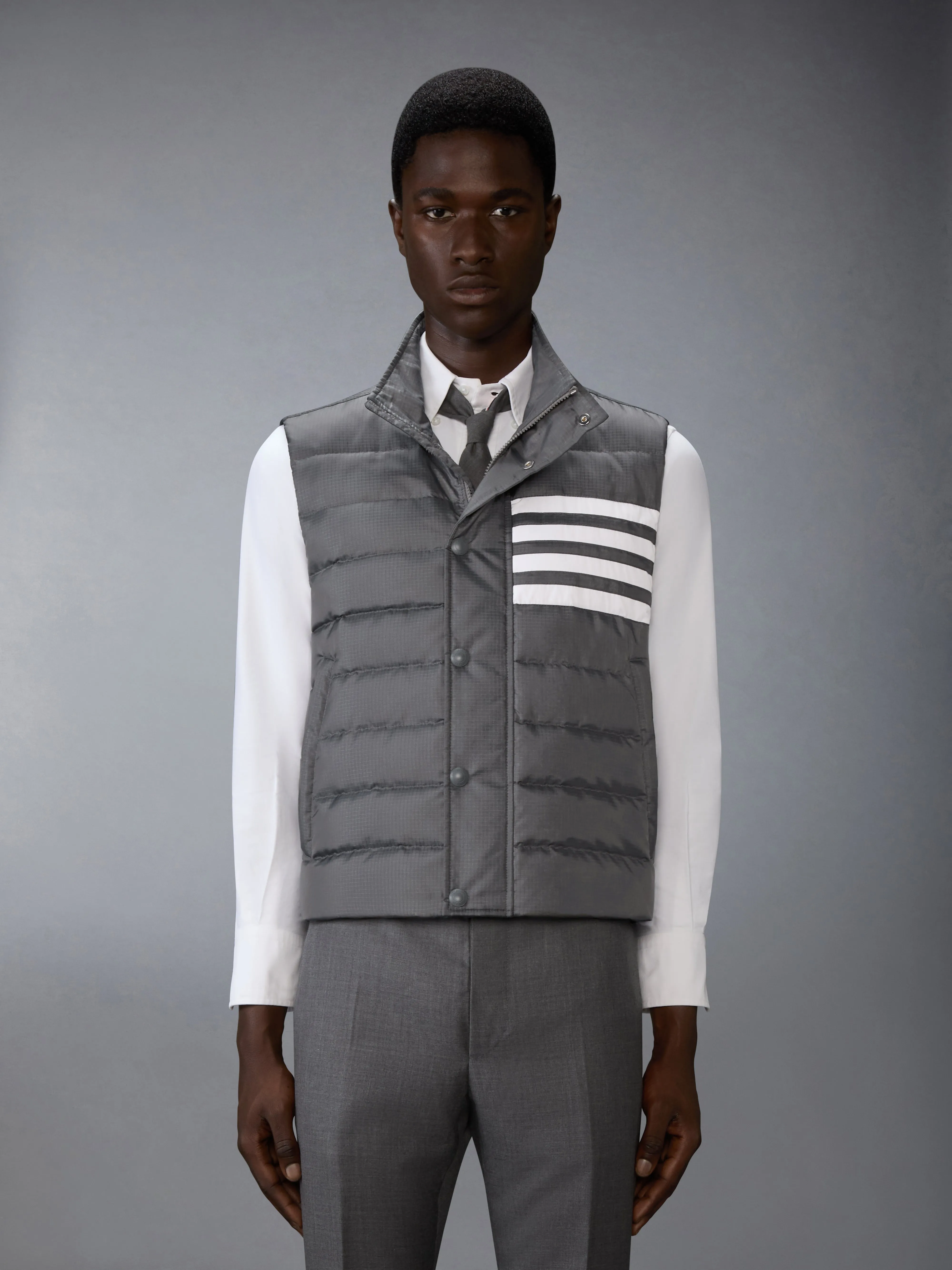 SHINY RIPSTOP LIGHTWEIGHT DOWN FILLED 4-BAR VEST sold by Thom Browne