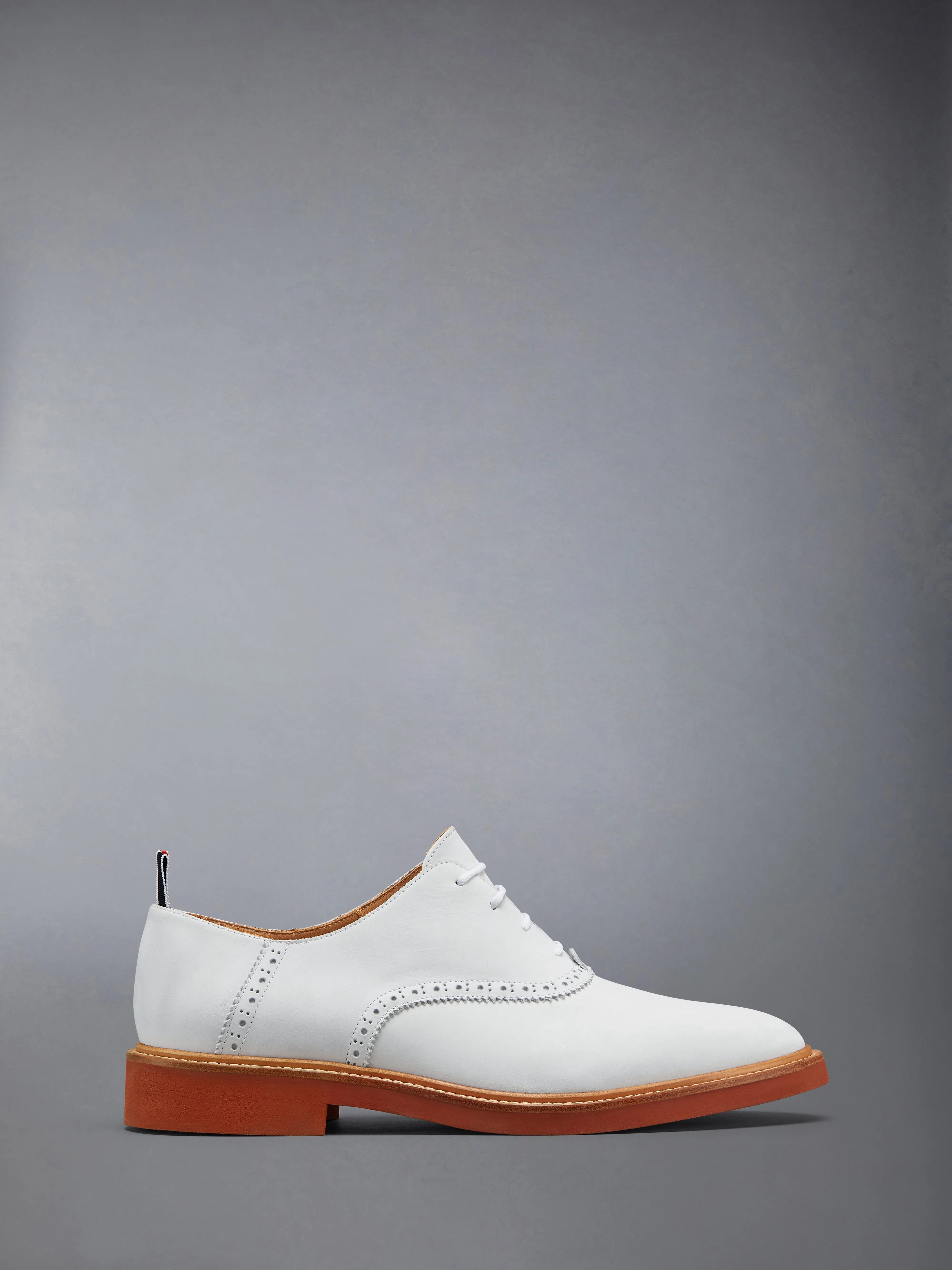 NUBUCK MICRO SOLE SADDLE SHOES sold by Thom Browne