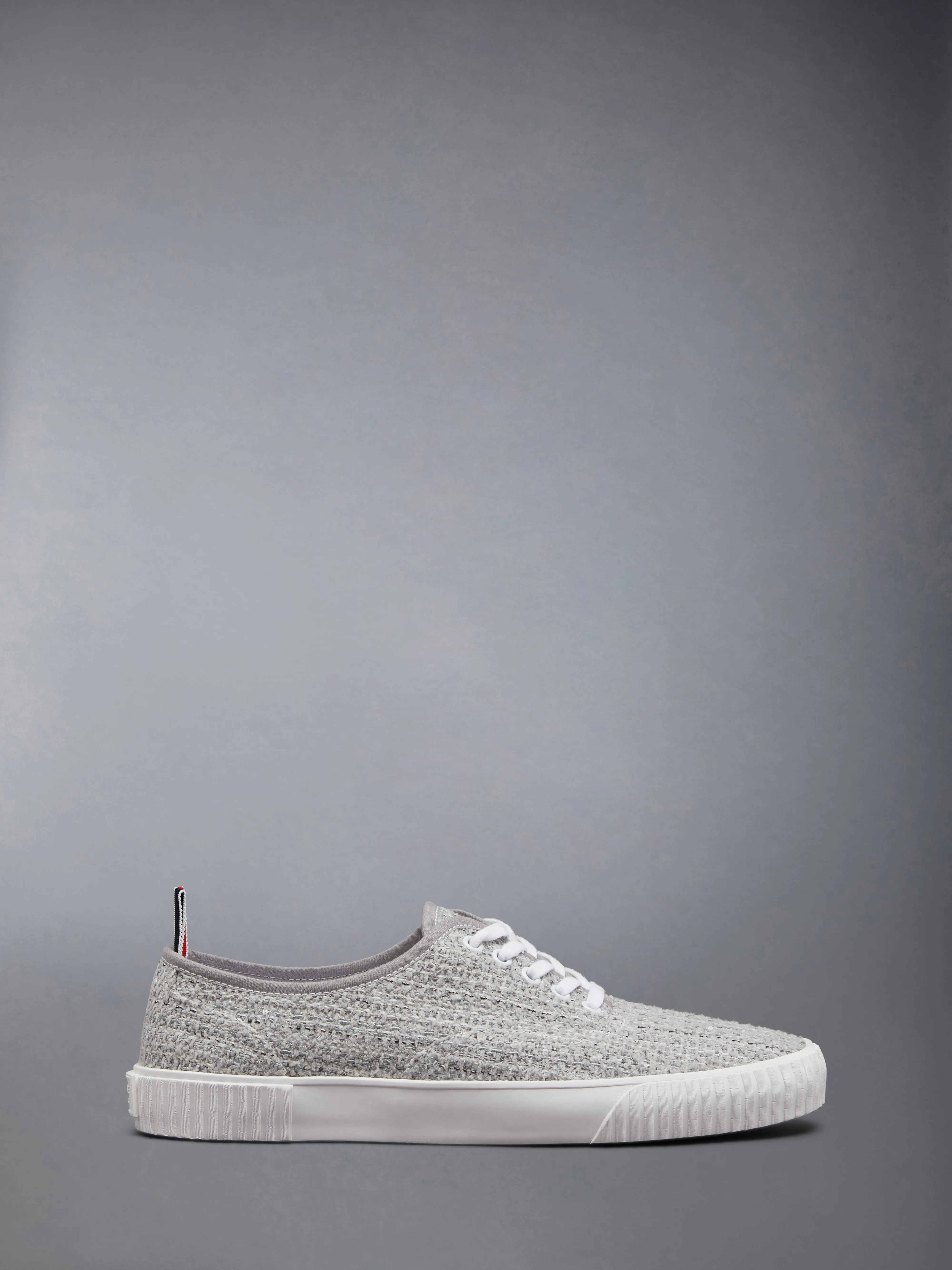 COTTON TWEED HERITAGE TRAINER sold by Thom Browne