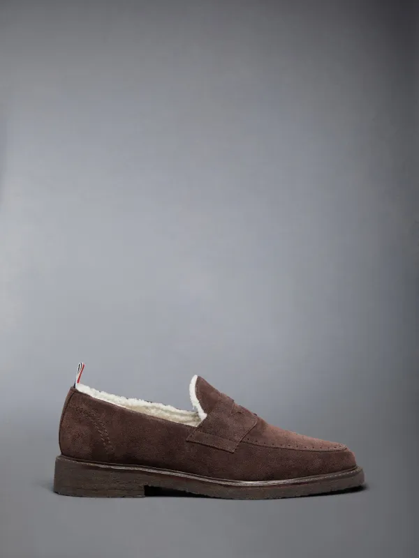 SUEDE CREPE SOLE SHEARLING PENNY LOAFER sold by Thom Browne