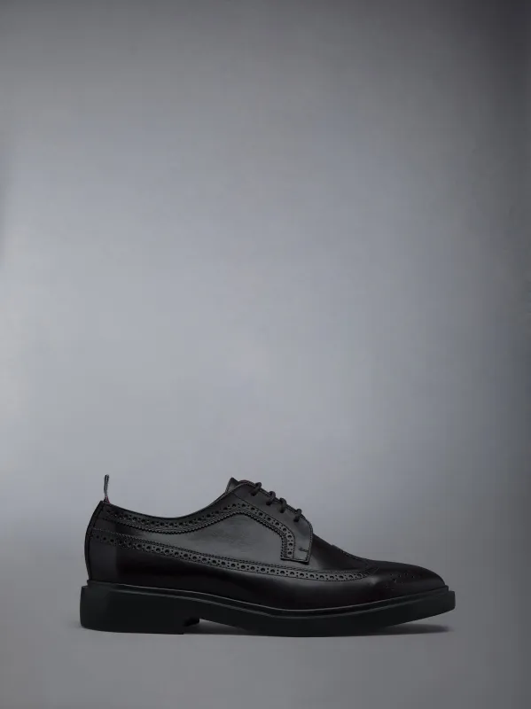 BOX CALF LONGWING RUBBER SOLE BROGUES sold by Thom Browne
