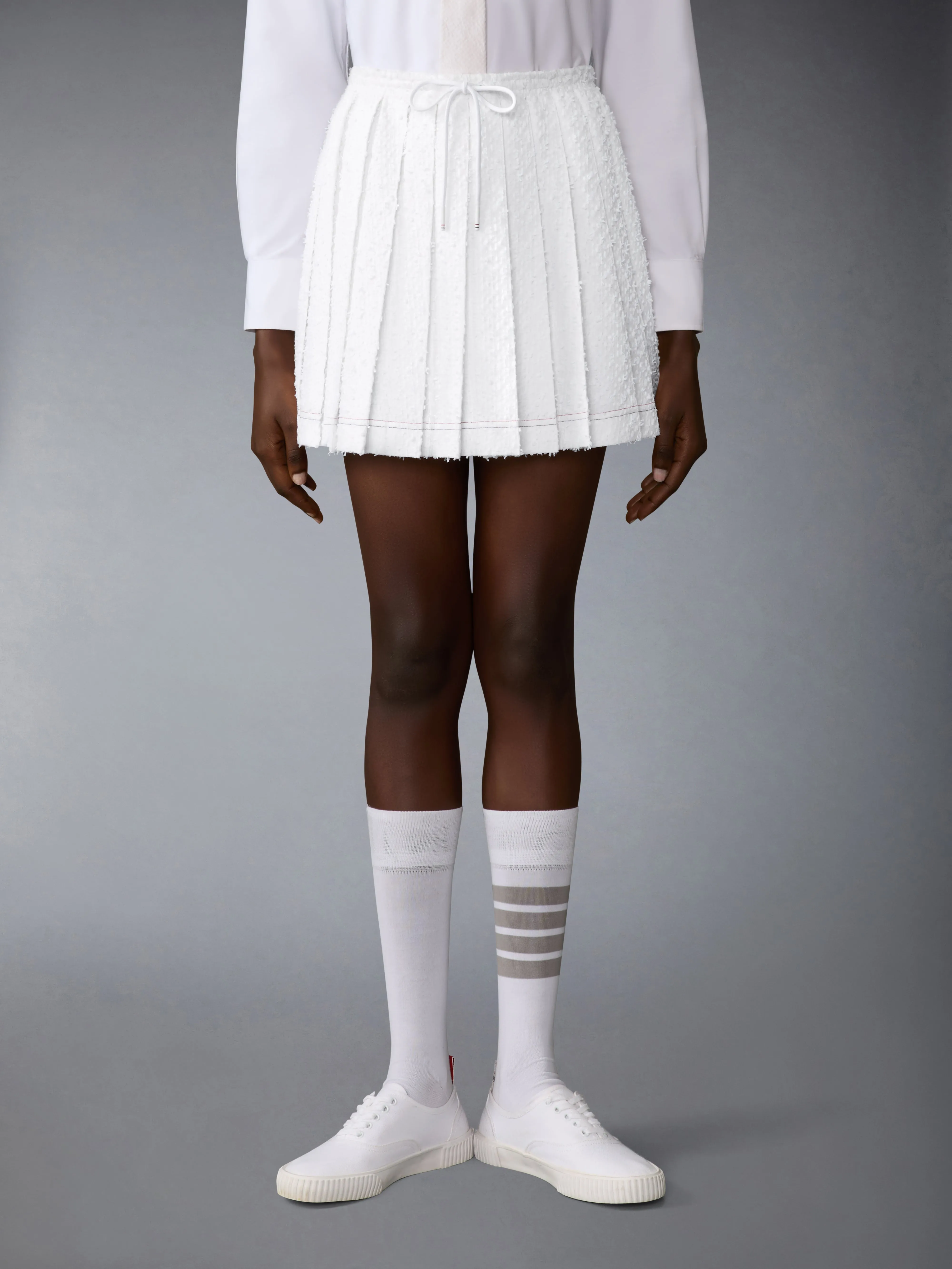 EYELASH TWEED DRAWSTRING PLEATED MINI SKIRT sold by Thom Browne