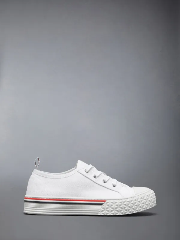 CANVAS TREAD SOLE COLLEGIATE SNEAKERS sold by Thom Browne