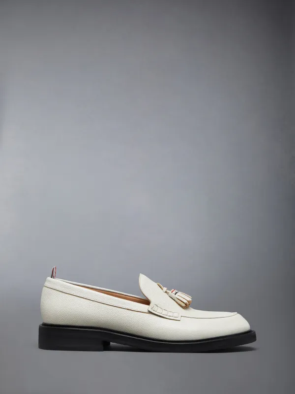 PEBBLE GRAIN RWB RUBBER SOLE TASSEL LOAFER sold by Thom Browne