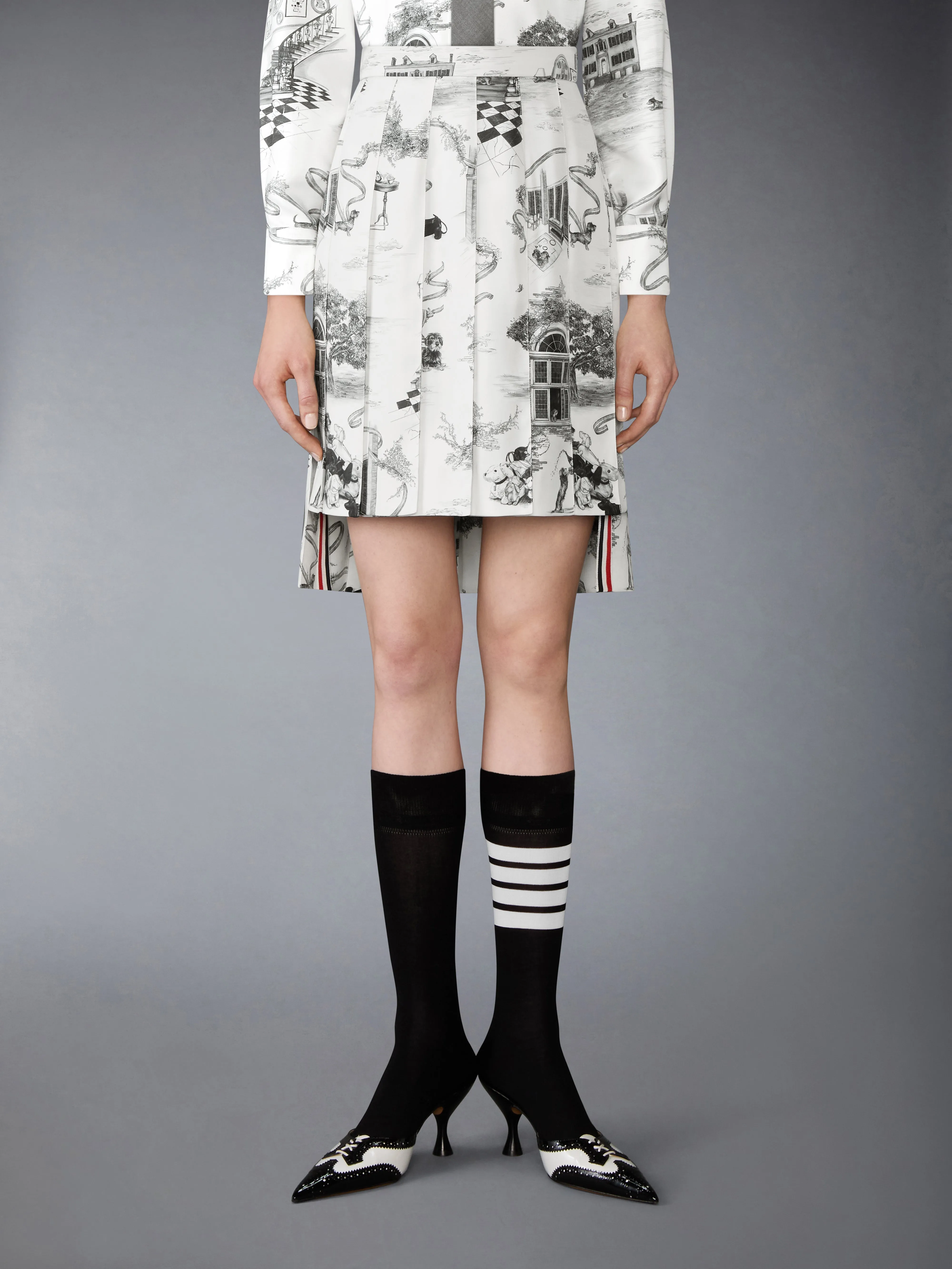 SILK TWILL HECTOR TOILE PLEATED SKIRT sold by Thom Browne