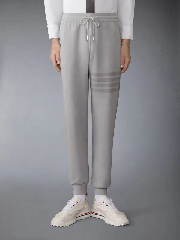 SOLID LOOPBACK OVERDYED 4-BAR SWEATPANTS sold by Thom Browne