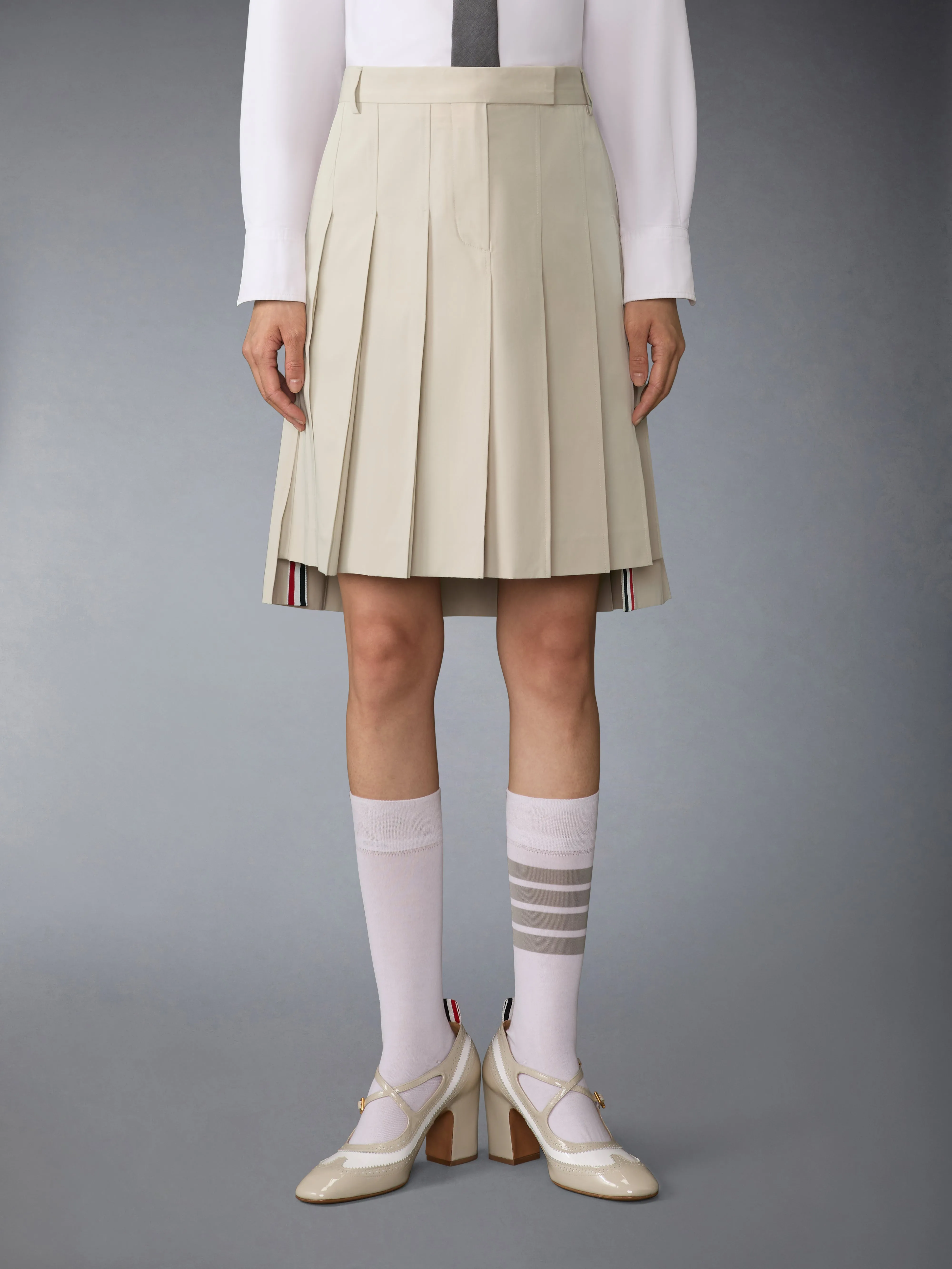 COTTON SUITING PLEATED SKIRT sold by Thom Browne