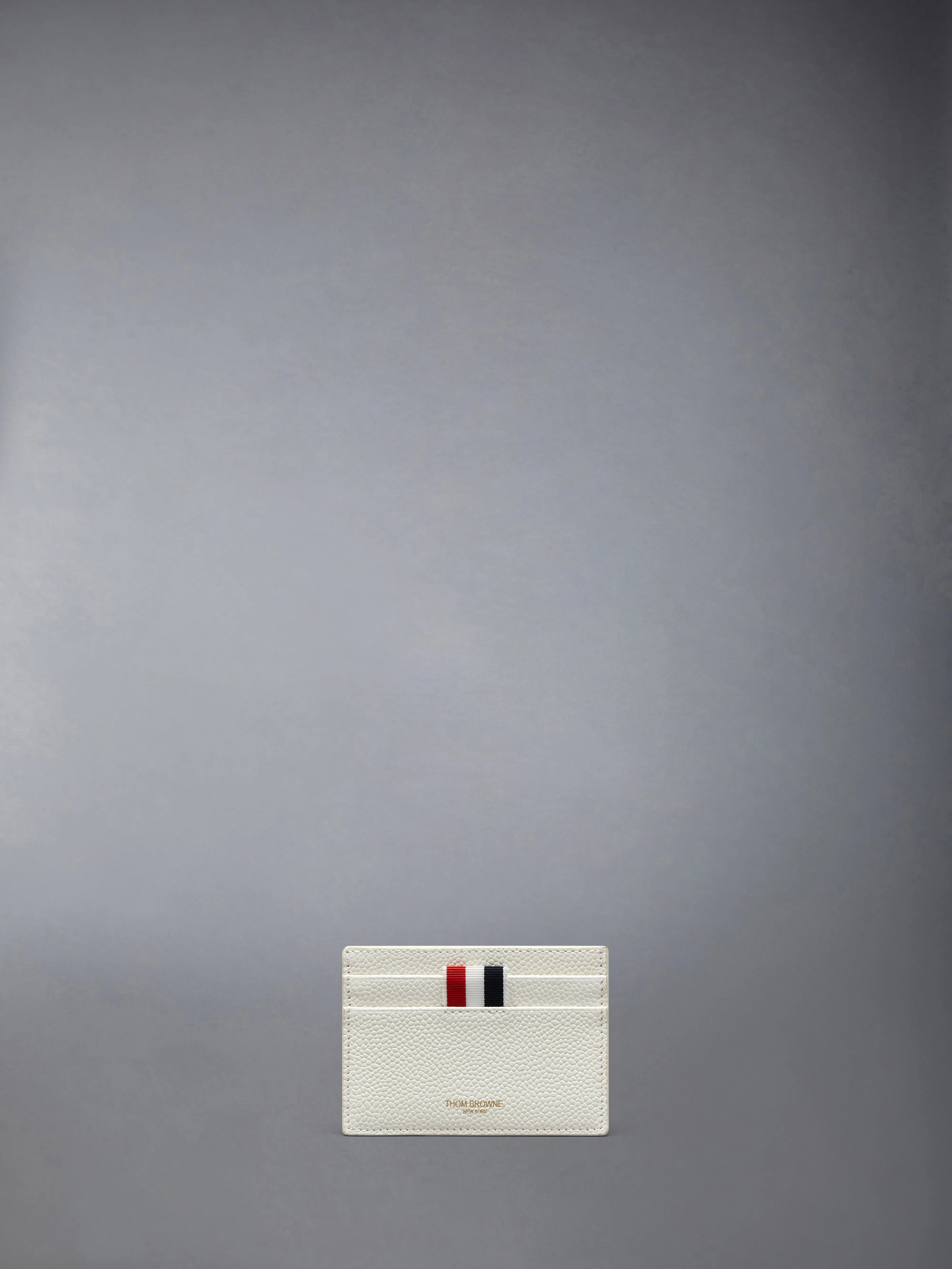 PEBBLE GRAIN HECTOR SINGLE CARD HOLDER sold by Thom Browne
