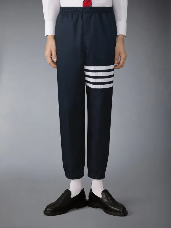 SHINY RIPSTOP 4-BAR TRACK PANTS made by Thom Browne