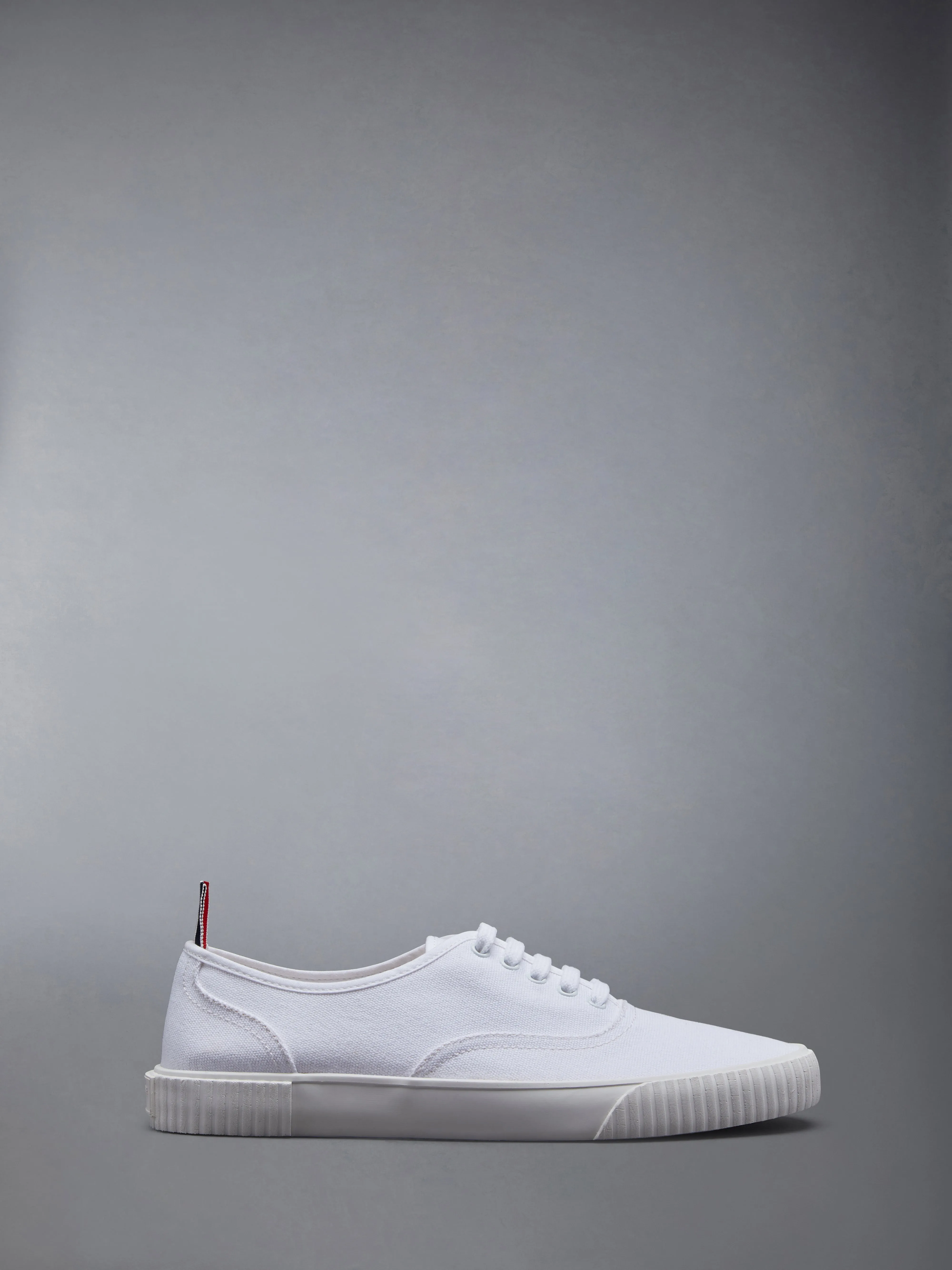 CANVAS VULCANIZED SOLE HERITAGE SNEAKERS sold by Thom Browne