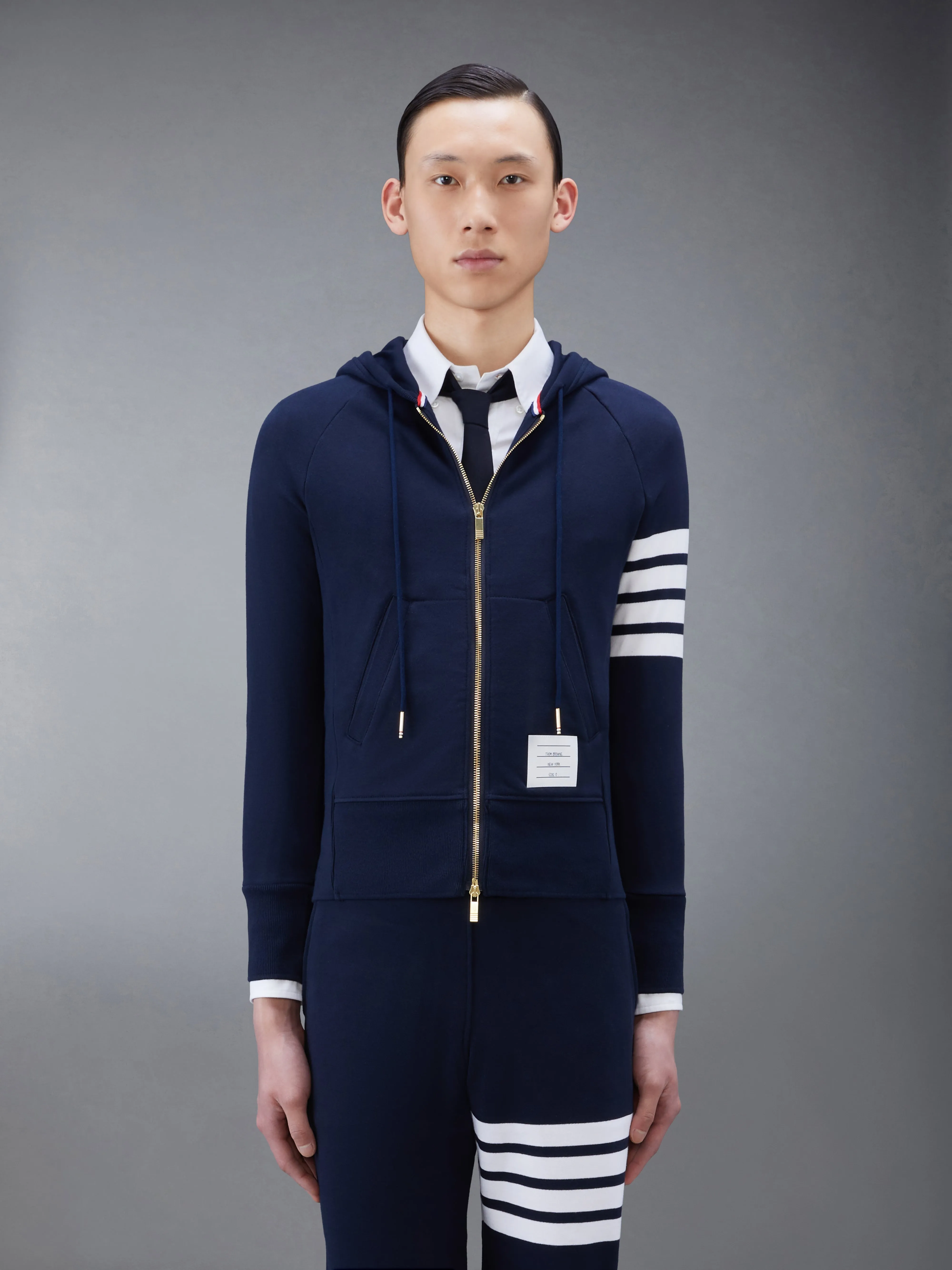 CLASSIC LOOPBACK 4-BAR ZIP UP HOODIE sold by Thom Browne