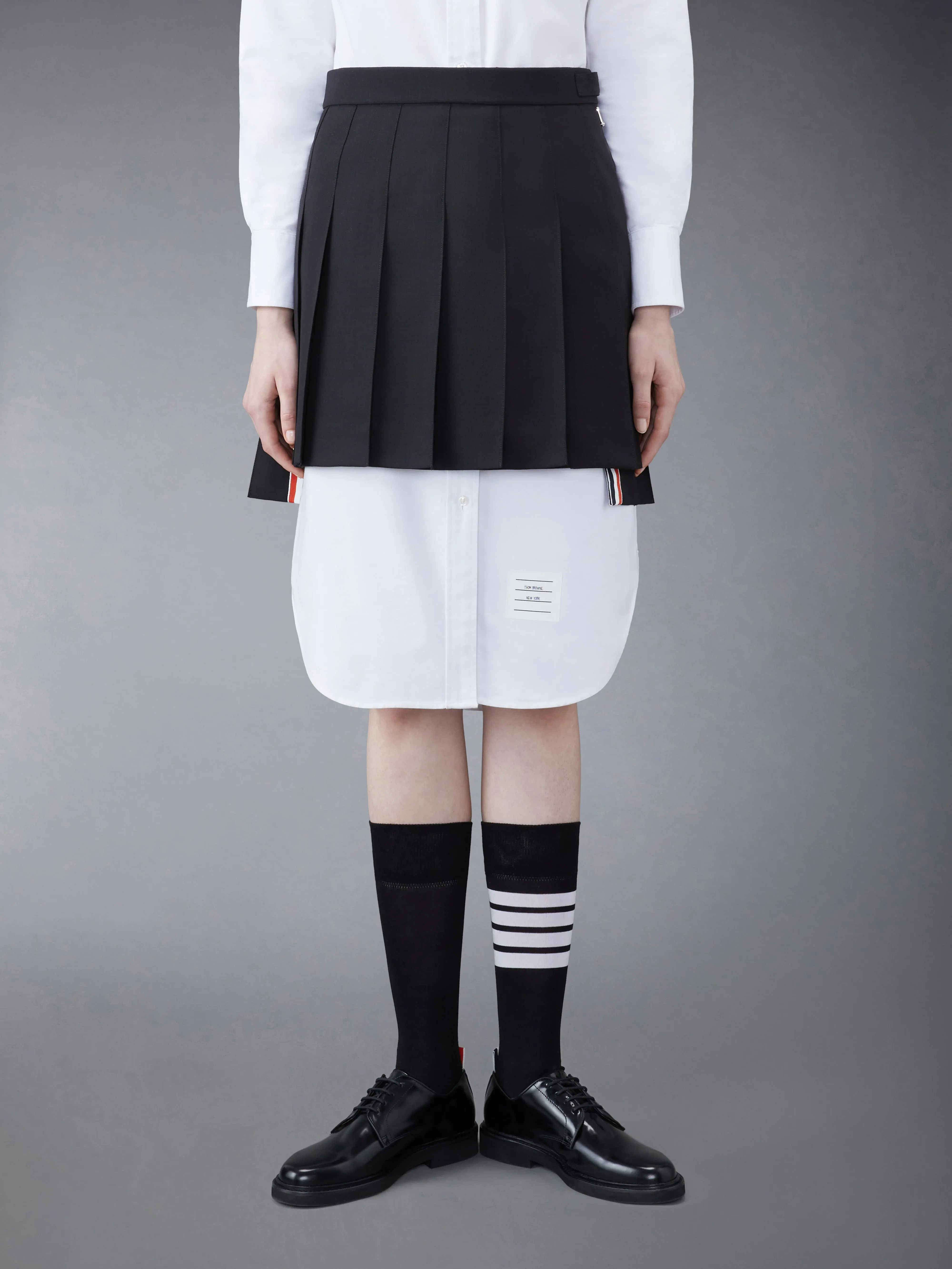 WOOL FRESCO PLEATED MINI SKIRT sold by Thom Browne