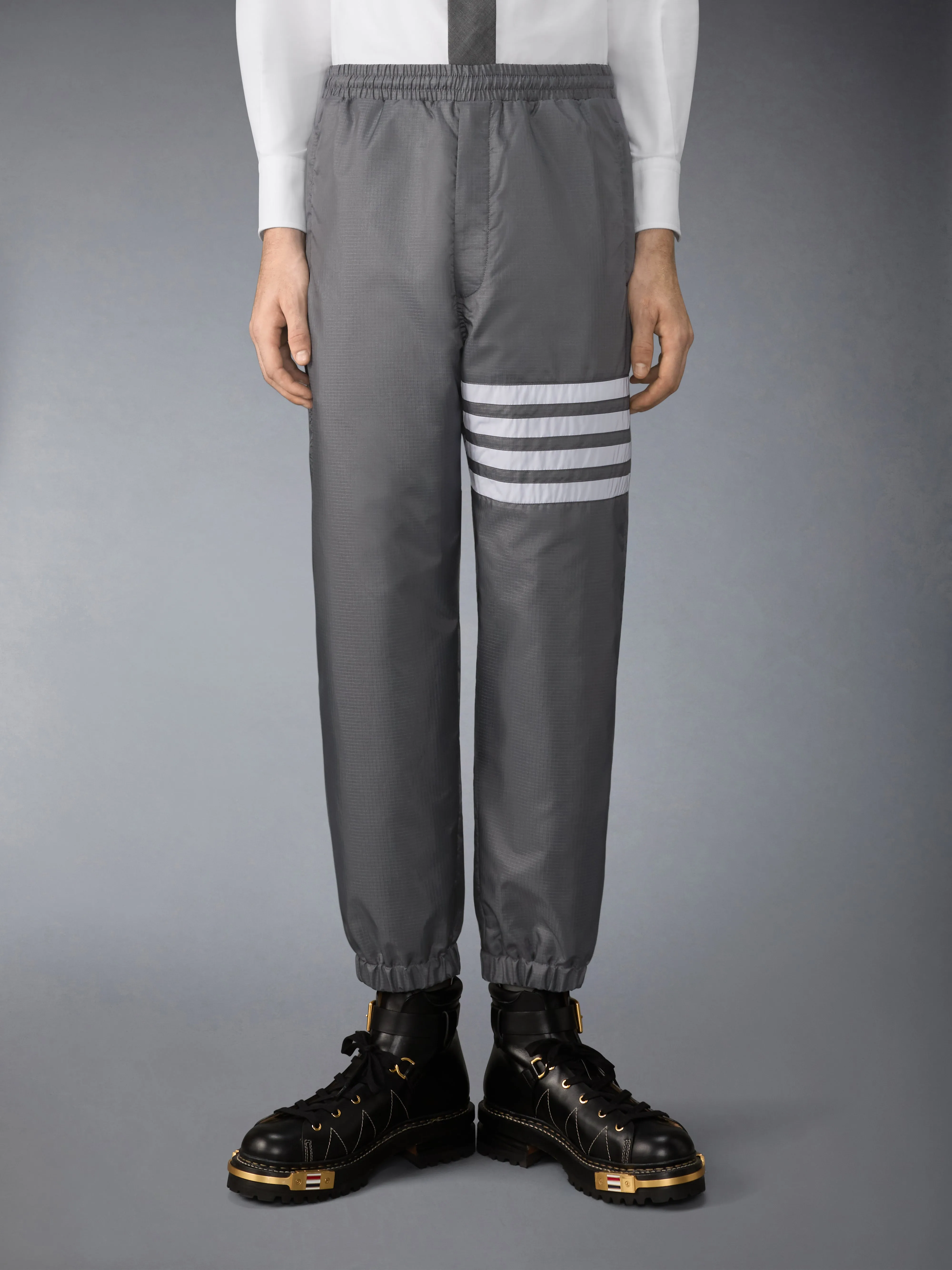 SHINY RIPSTOP 4-BAR TRACK PANTS sold by Thom Browne