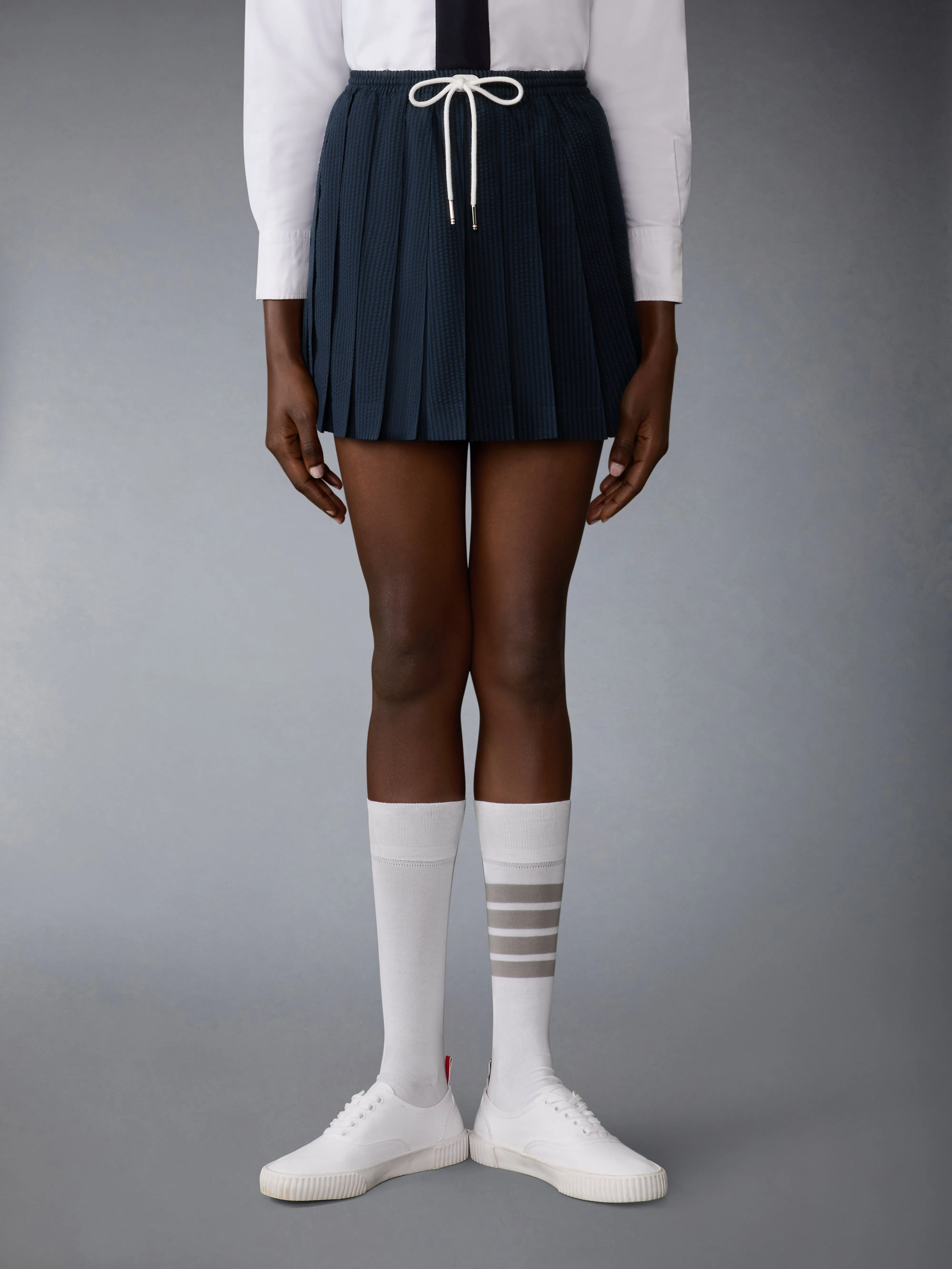 WOOL SEERSUCKER DRAWSTRING PLEATED MINI SKIRT sold by Thom Browne