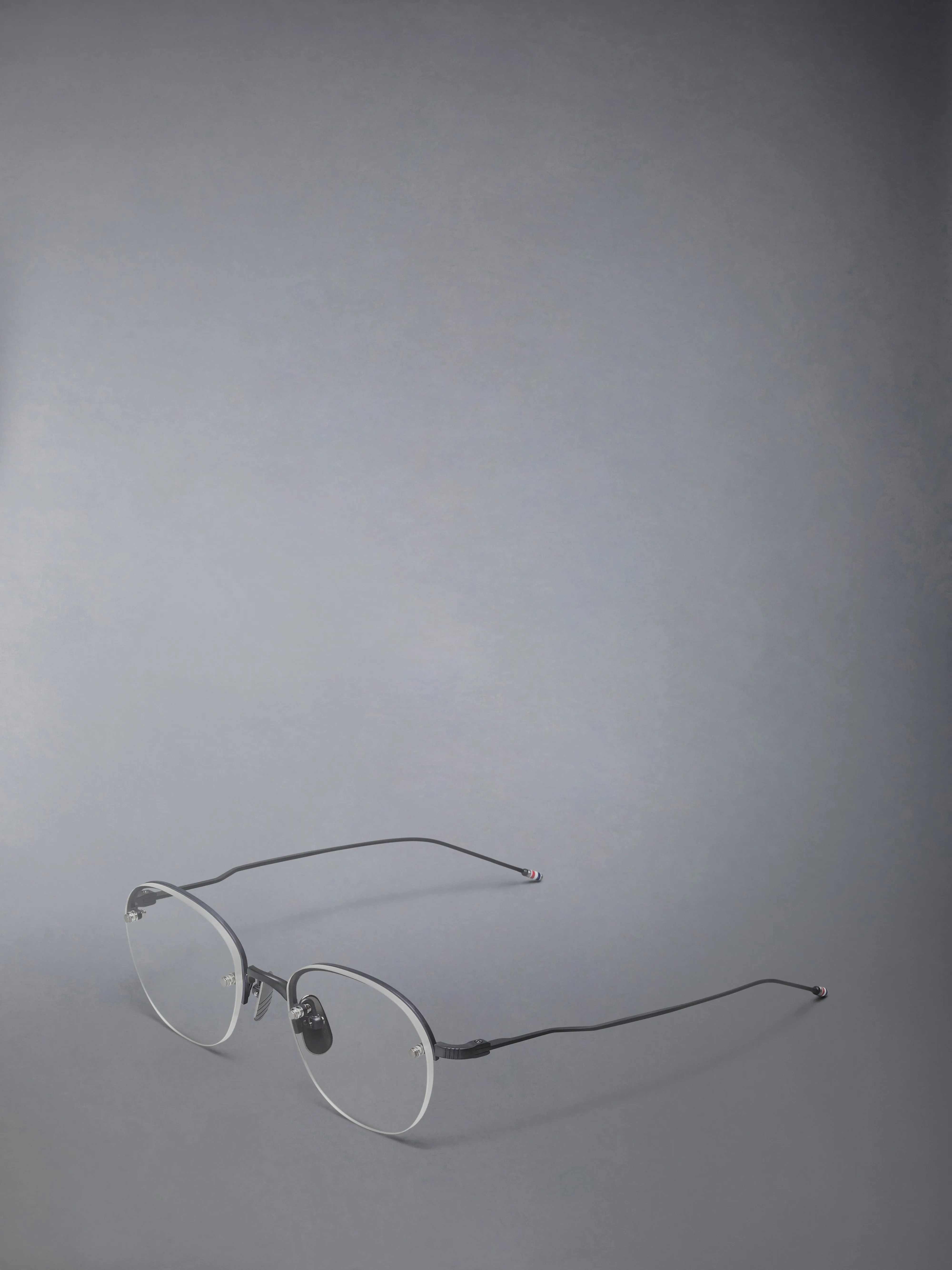 TITANIUM SEMI RIMLESS OVAL EYEGLASSES sold by Thom Browne product image thumbnail 2