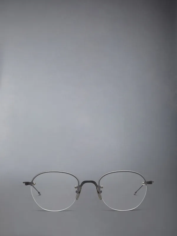 TITANIUM SEMI RIMLESS OVAL EYEGLASSES made by Thom Browne