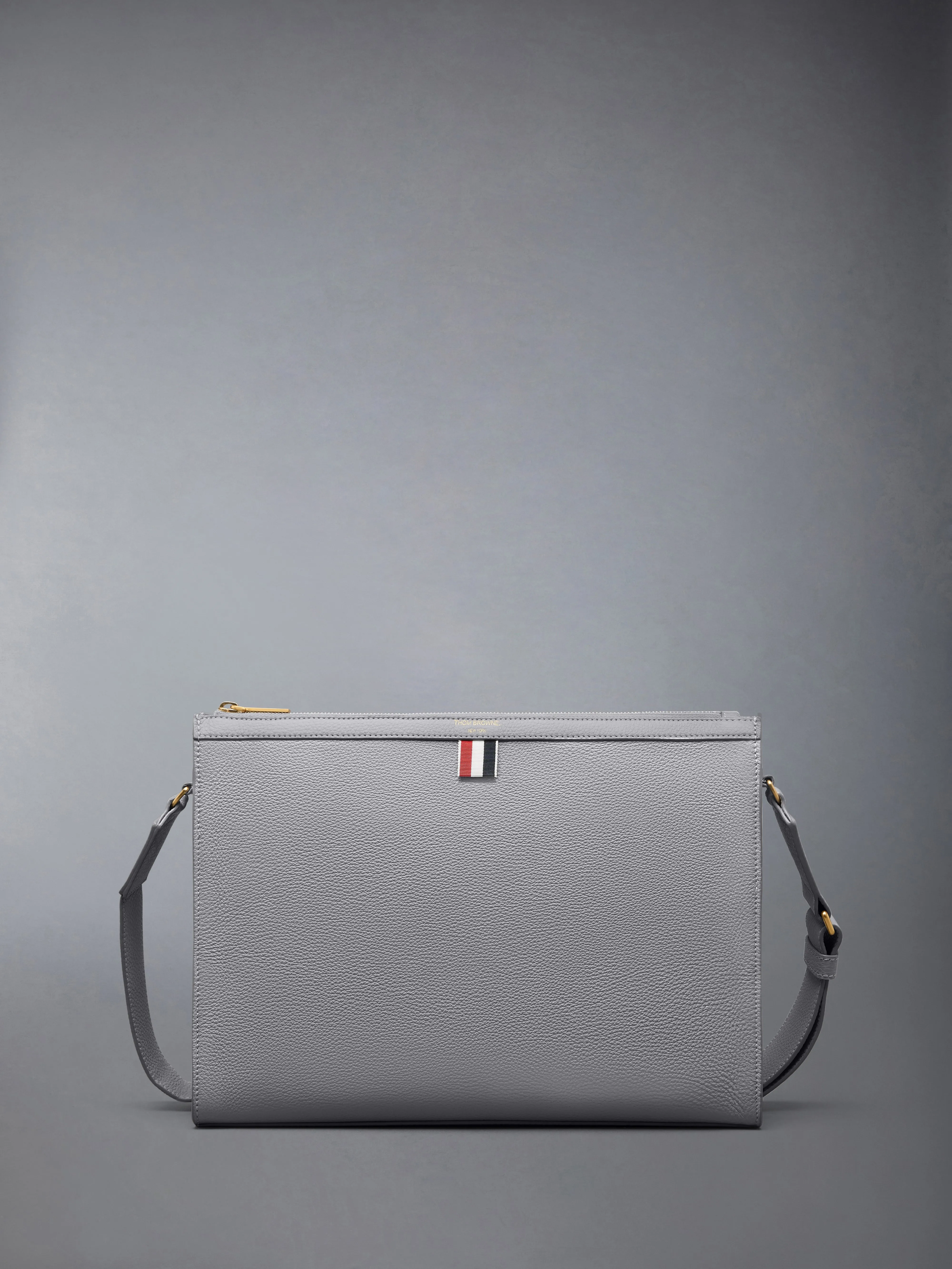 SOFT PEBBLE GRAIN 4-BAR CROSSBODY DOCUMENT HOLDER sold by Thom Browne