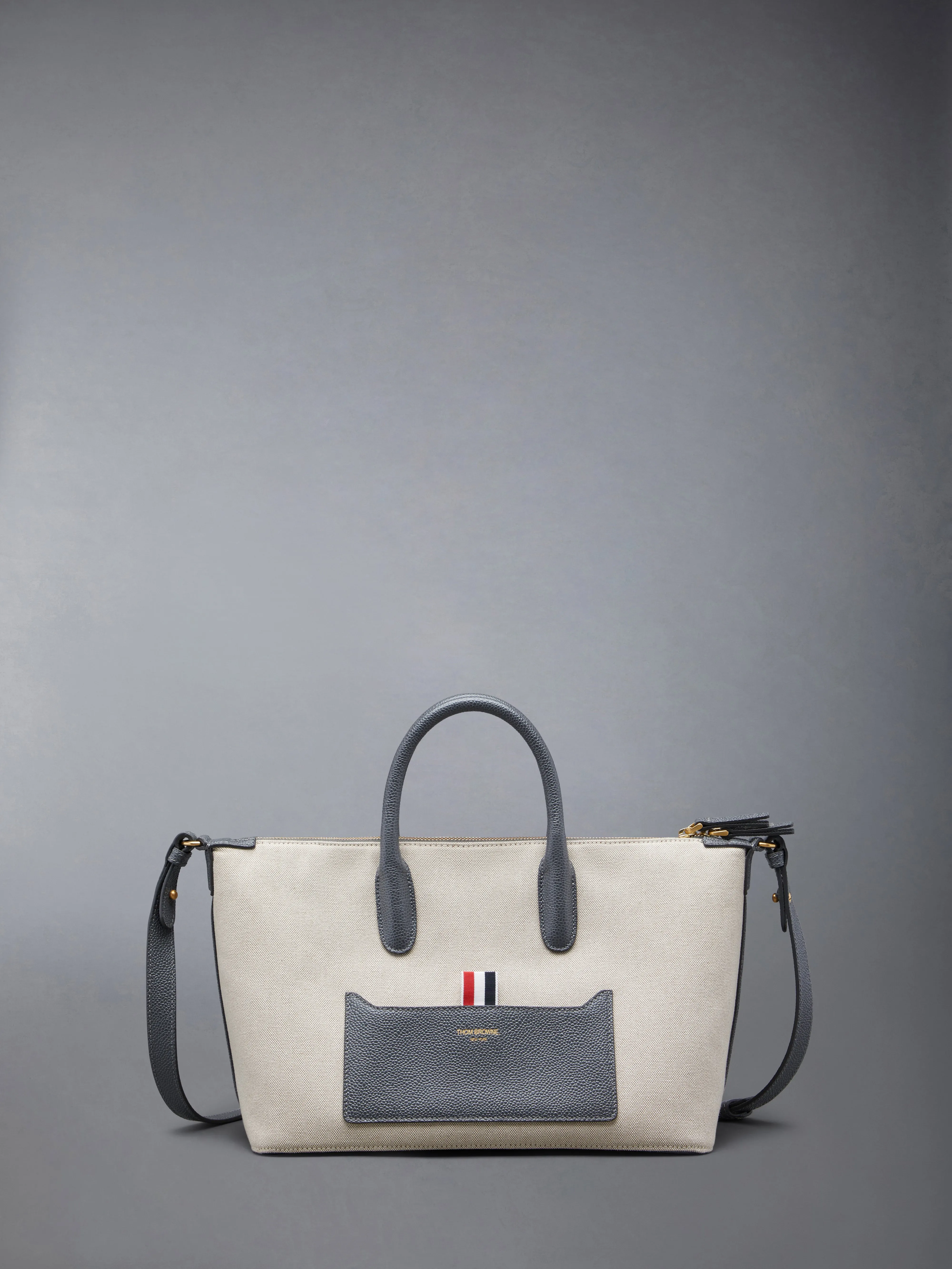 SMALL DUFFLE IN SALT AND PEPPER COTTON CANVAS sold by Thom Browne