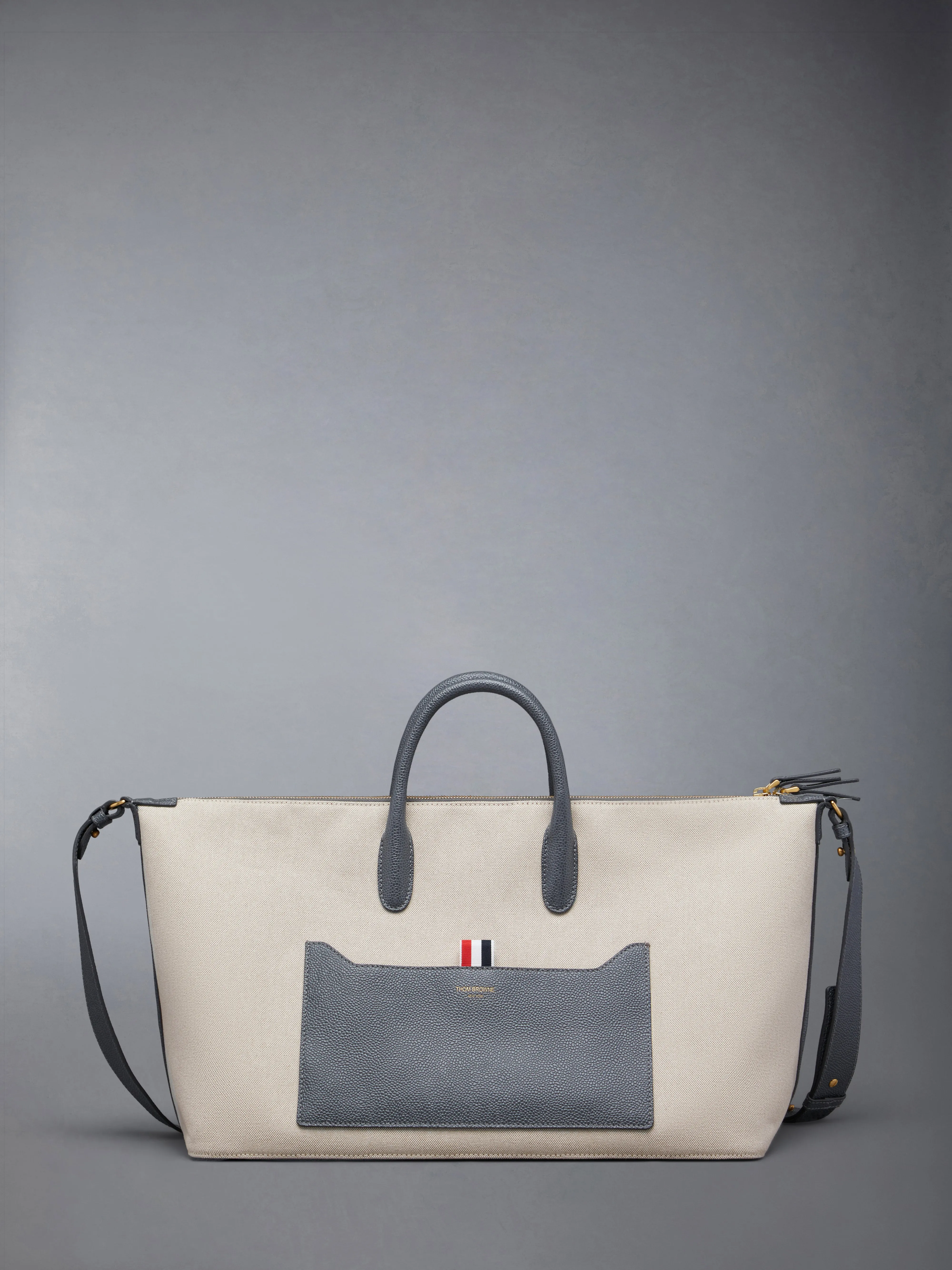 MEDIUM DUFFLE IN SALT AND PEPPER COTTON CANVAS sold by Thom Browne