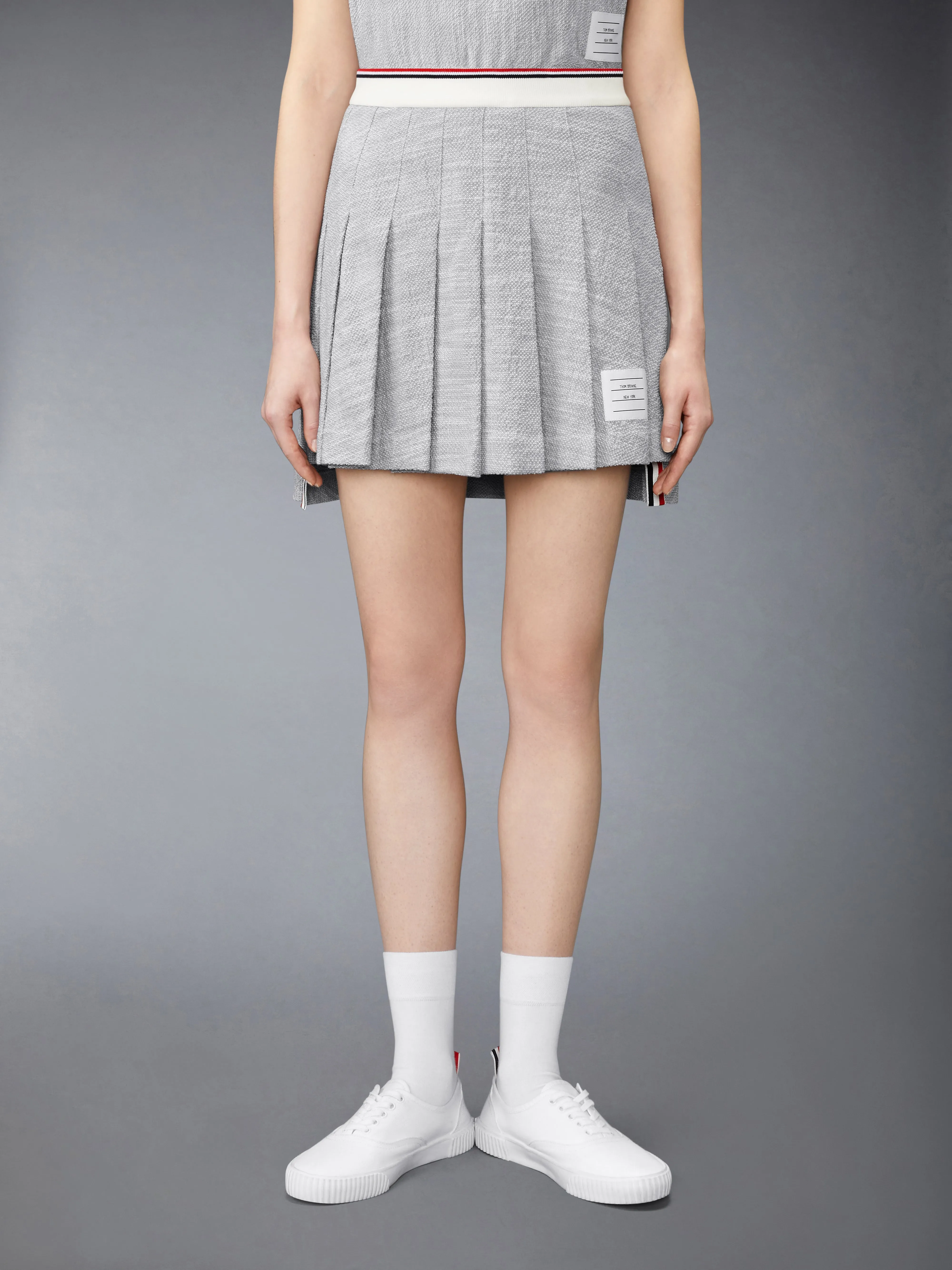 COTTON TWEED PLEATED MINI SKIRT sold by Thom Browne